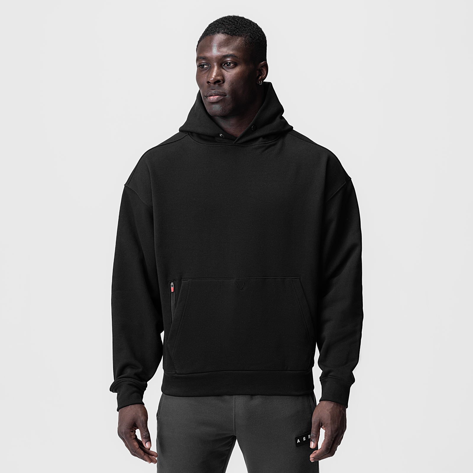 Tech-Terry Zip Pocket Hoodie in black, worn by model, front view