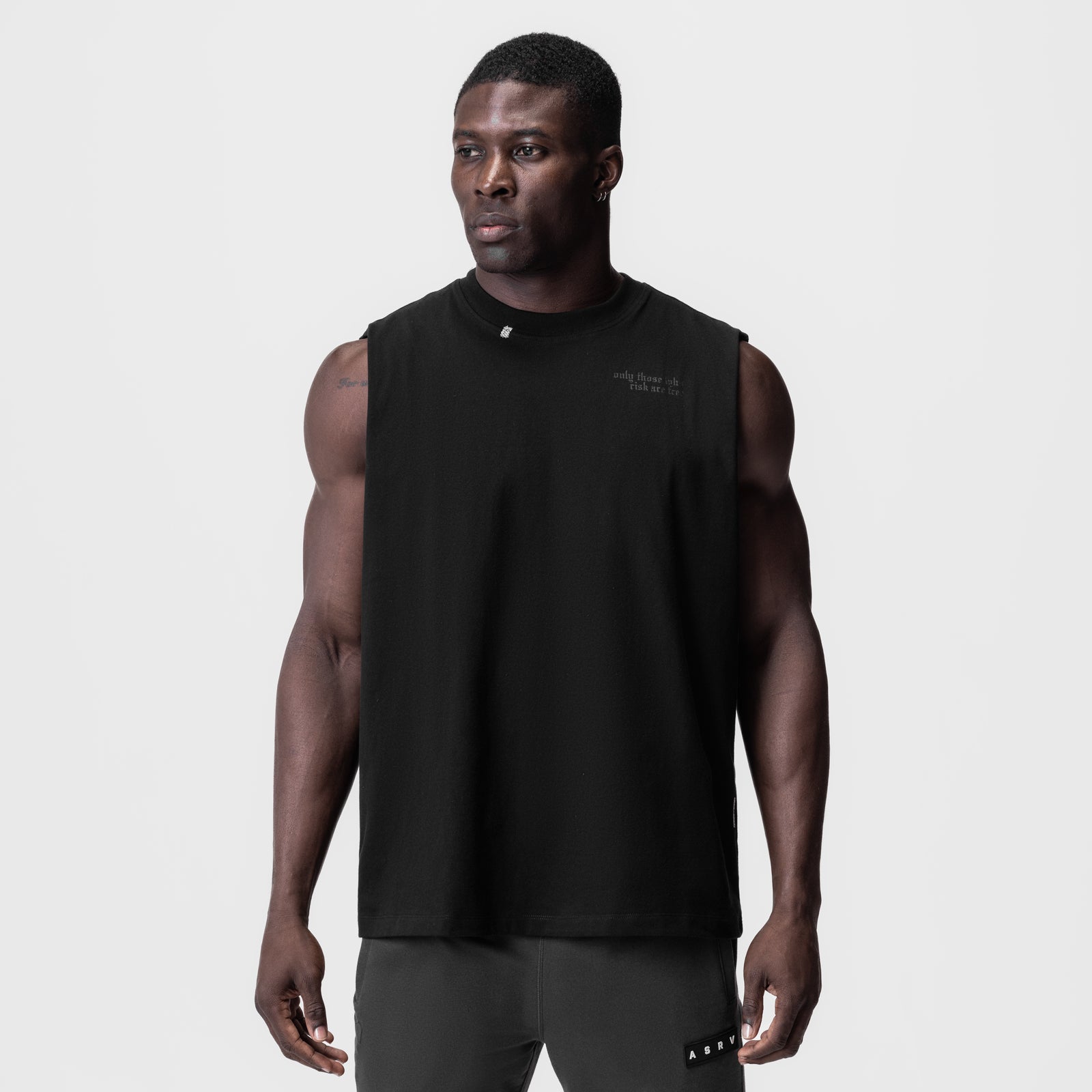 Black Tech Essential Relaxed Cutoff sleeveless shirt worn by male model, front view