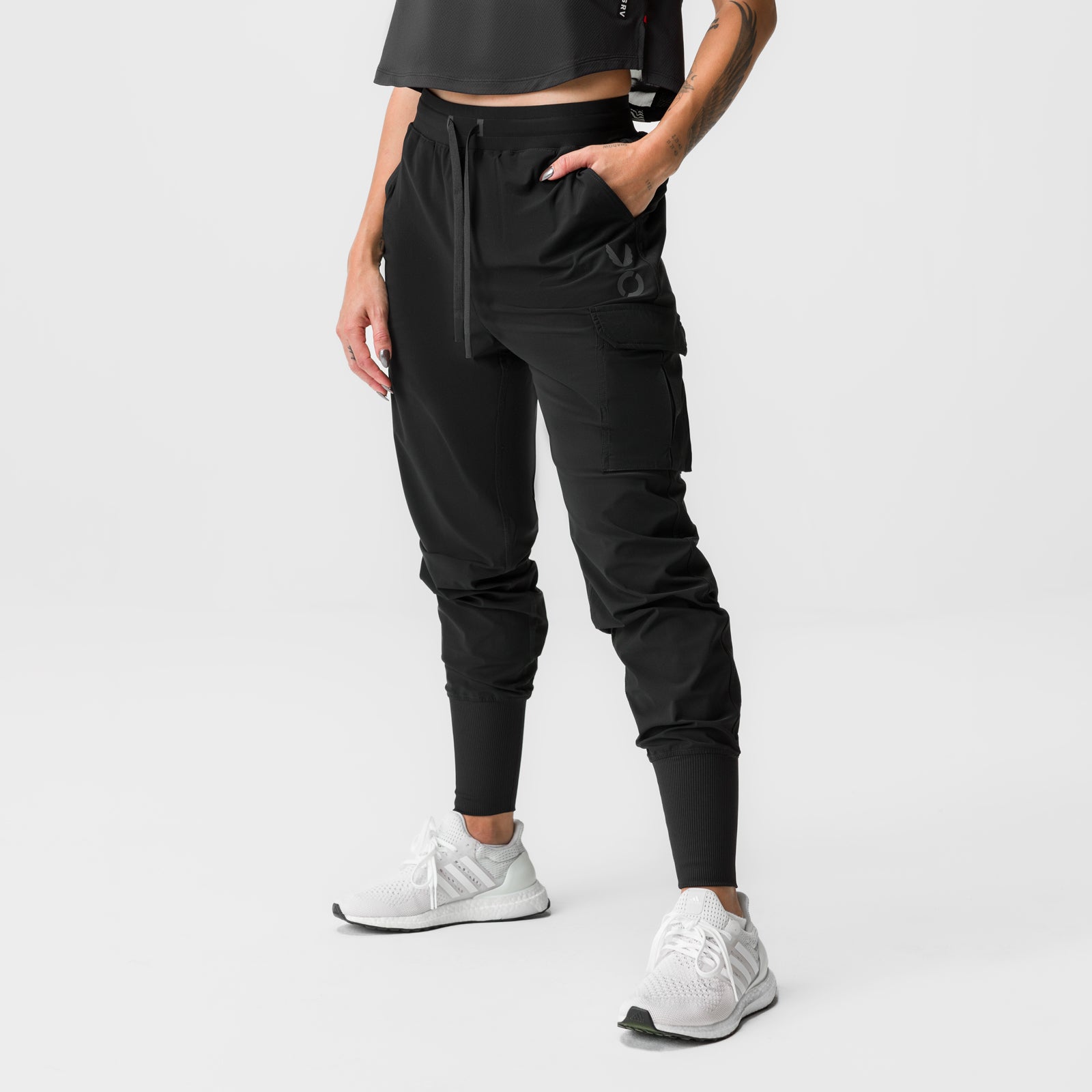 Black Tetra-Lite cargo jogger worn with white sneakers, front view