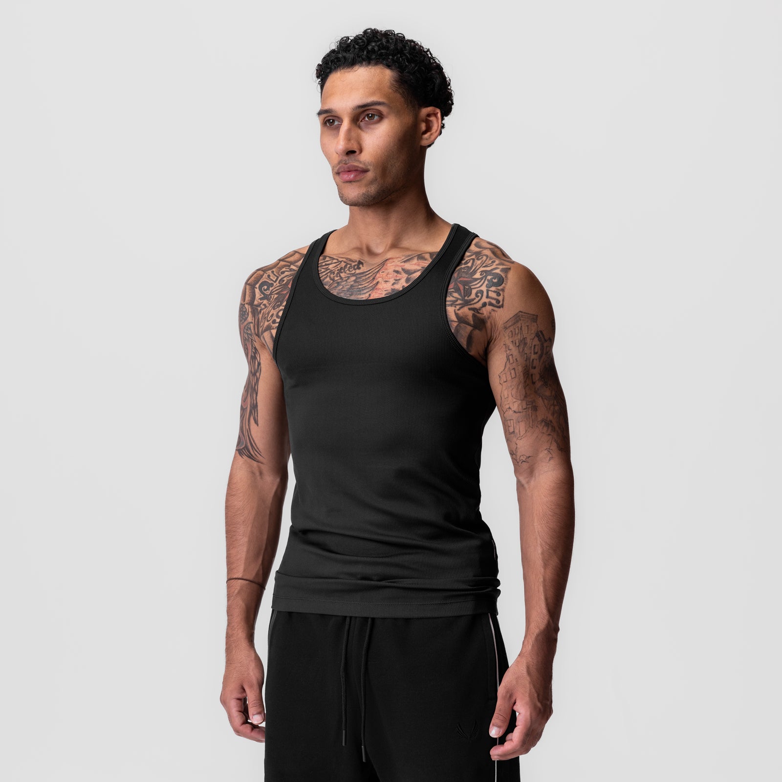 Black Creora® Tech Ribbed Tank worn by model, front view