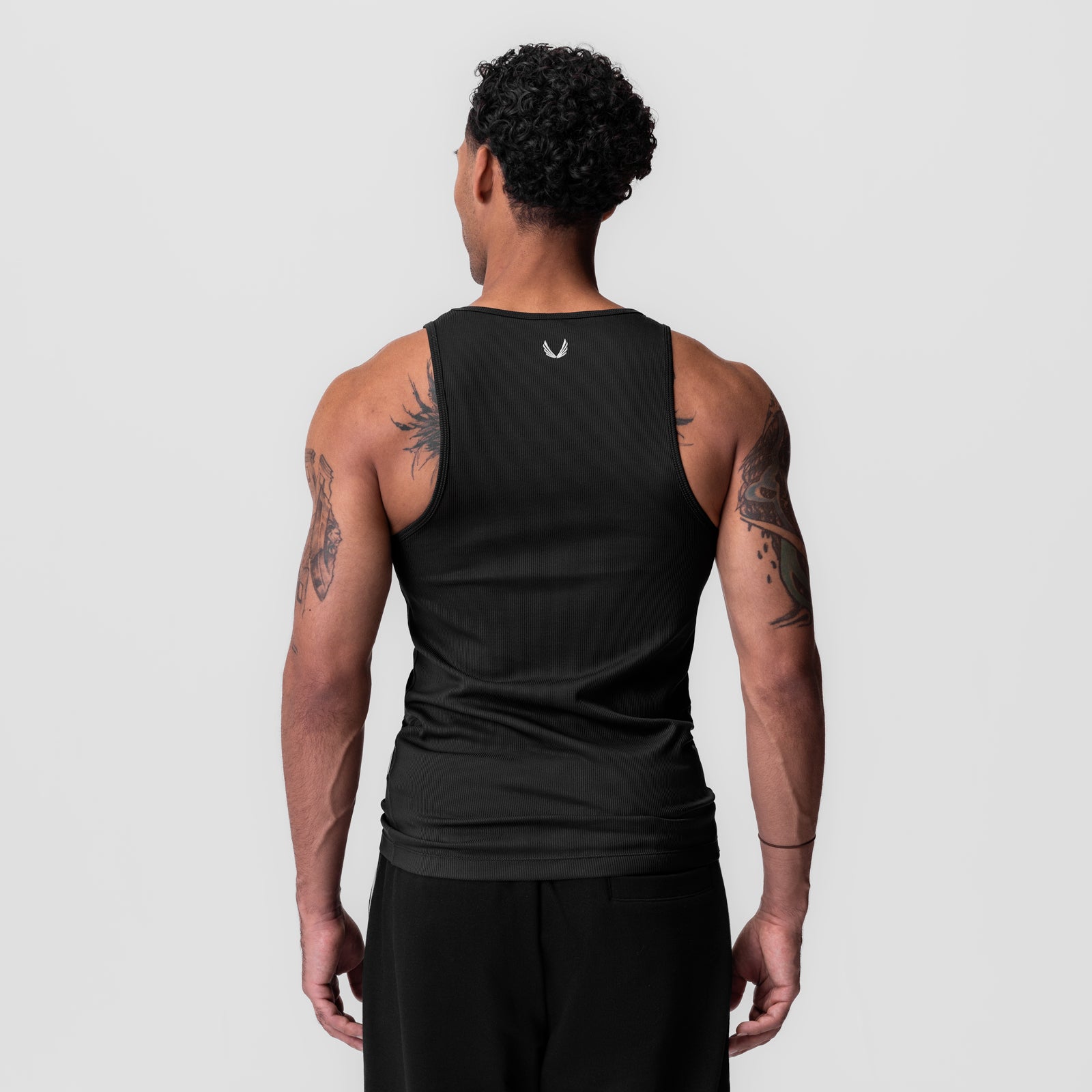 Black Creora® Tech Ribbed Tank worn by model, back view