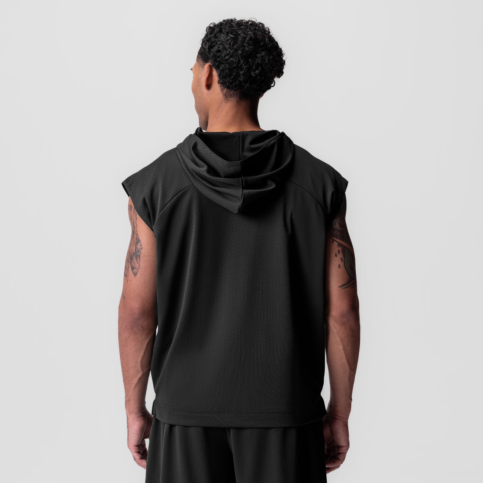 Reversible 2-in-1 cutoff hoodie in black, back view on model