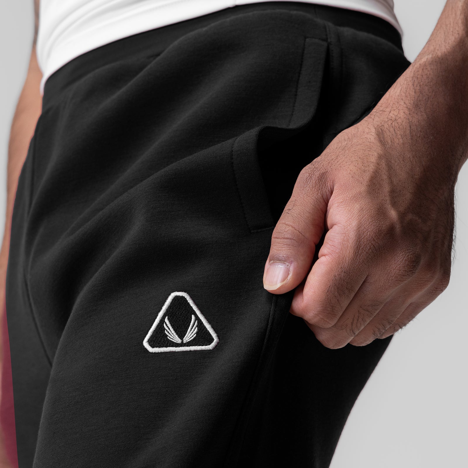 Black Dri-Core Training Jogger worn by model, side pocket detail with white logo