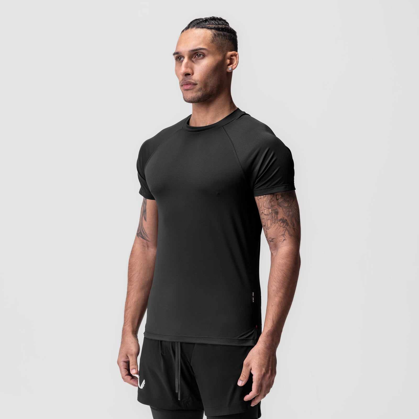AeroSilver® Fitted Tee in black, worn by model in side profile stance