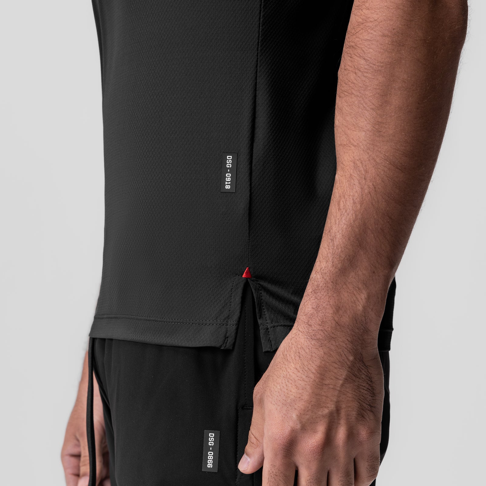 AeroSilver Fitted Tee in black, worn by model, side detail view