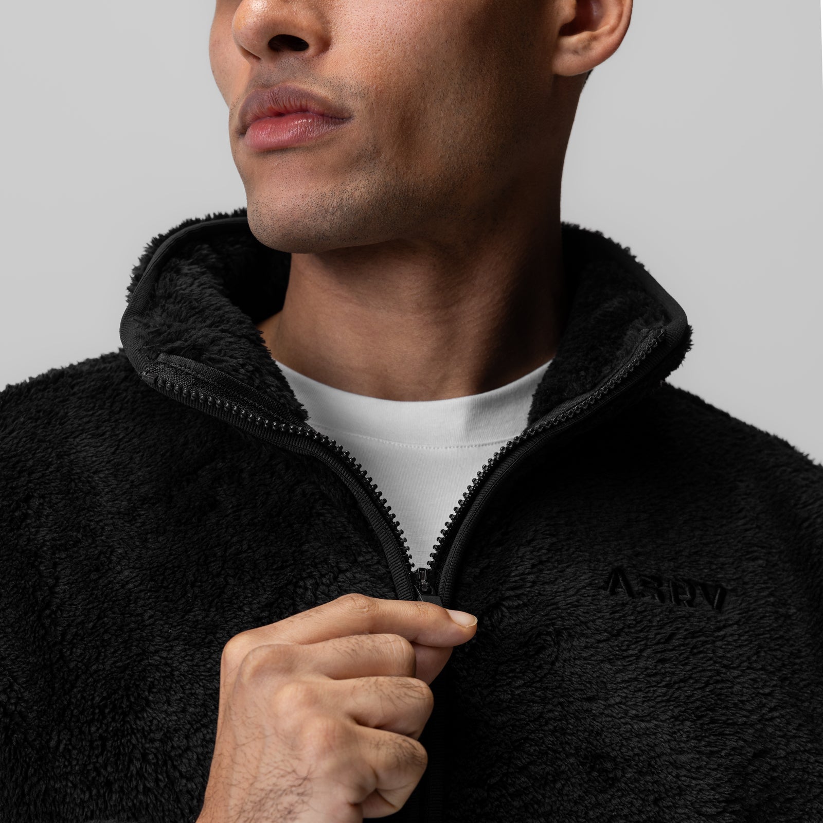 Black Sherpa Recovery 1/2 Zip worn by male model with white undershirt, front view