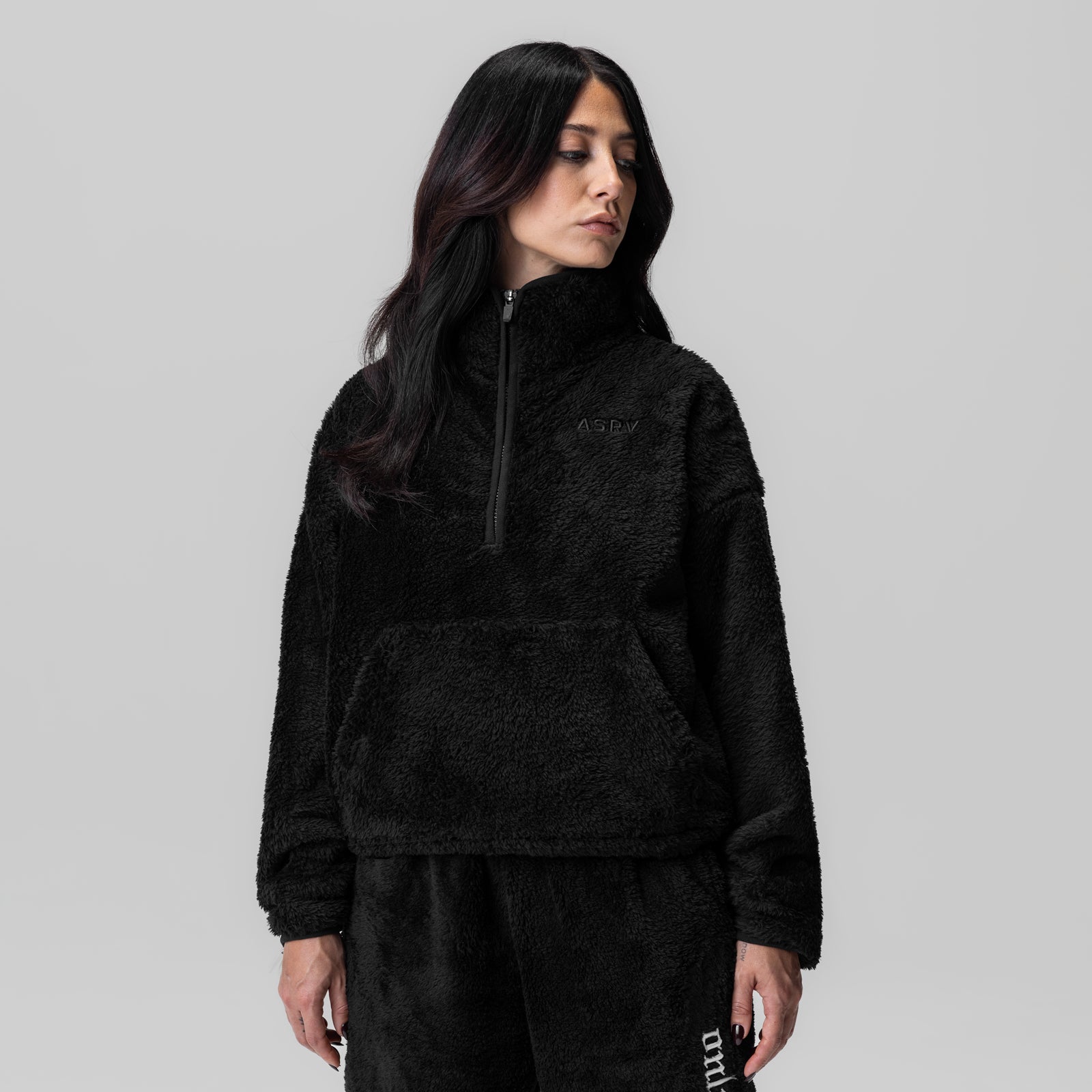 Women's Sherpa Recovery 1/2 Zip in black, modeled from side angle