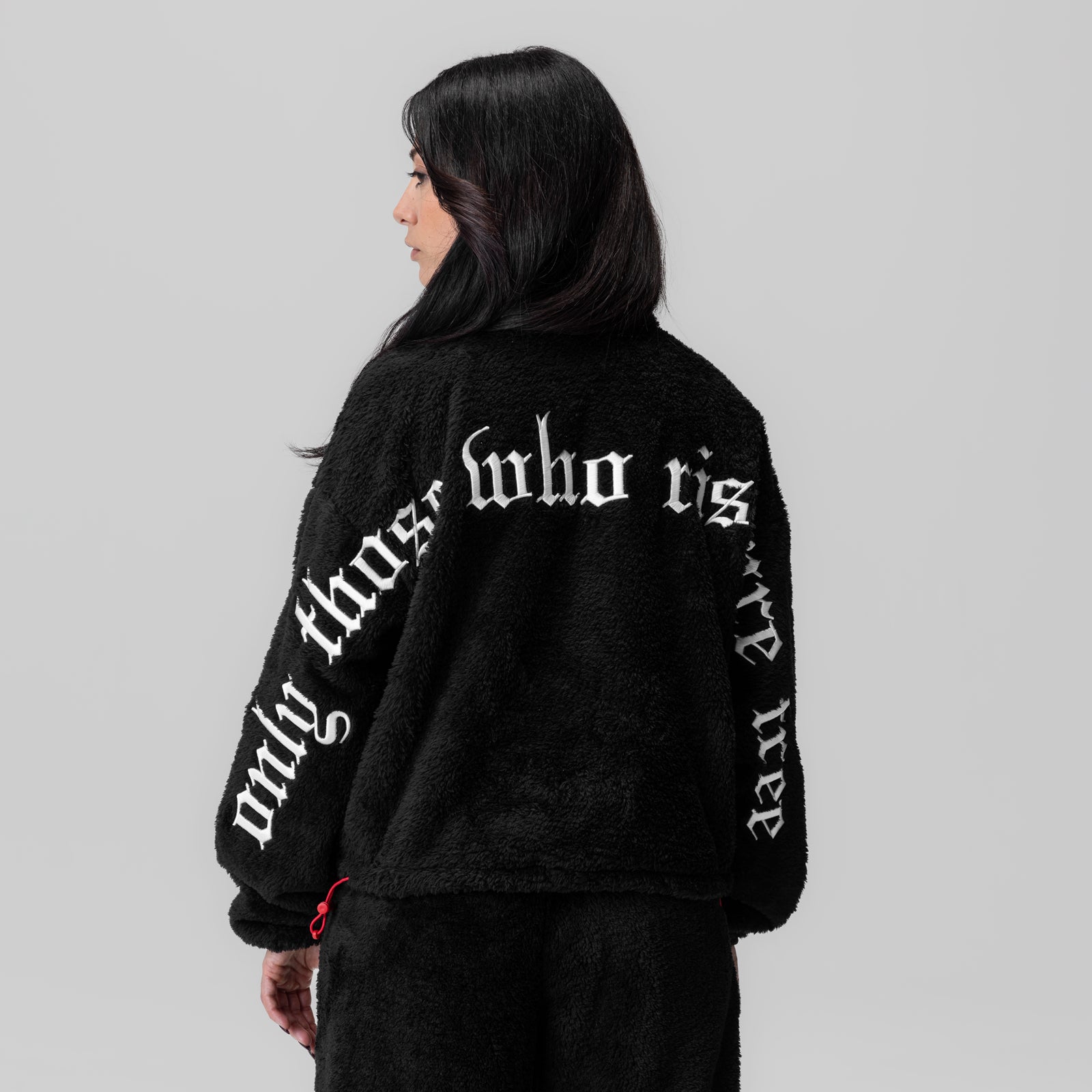 Women's Sherpa Recovery 1/2 Zip in black with white text, back view on model