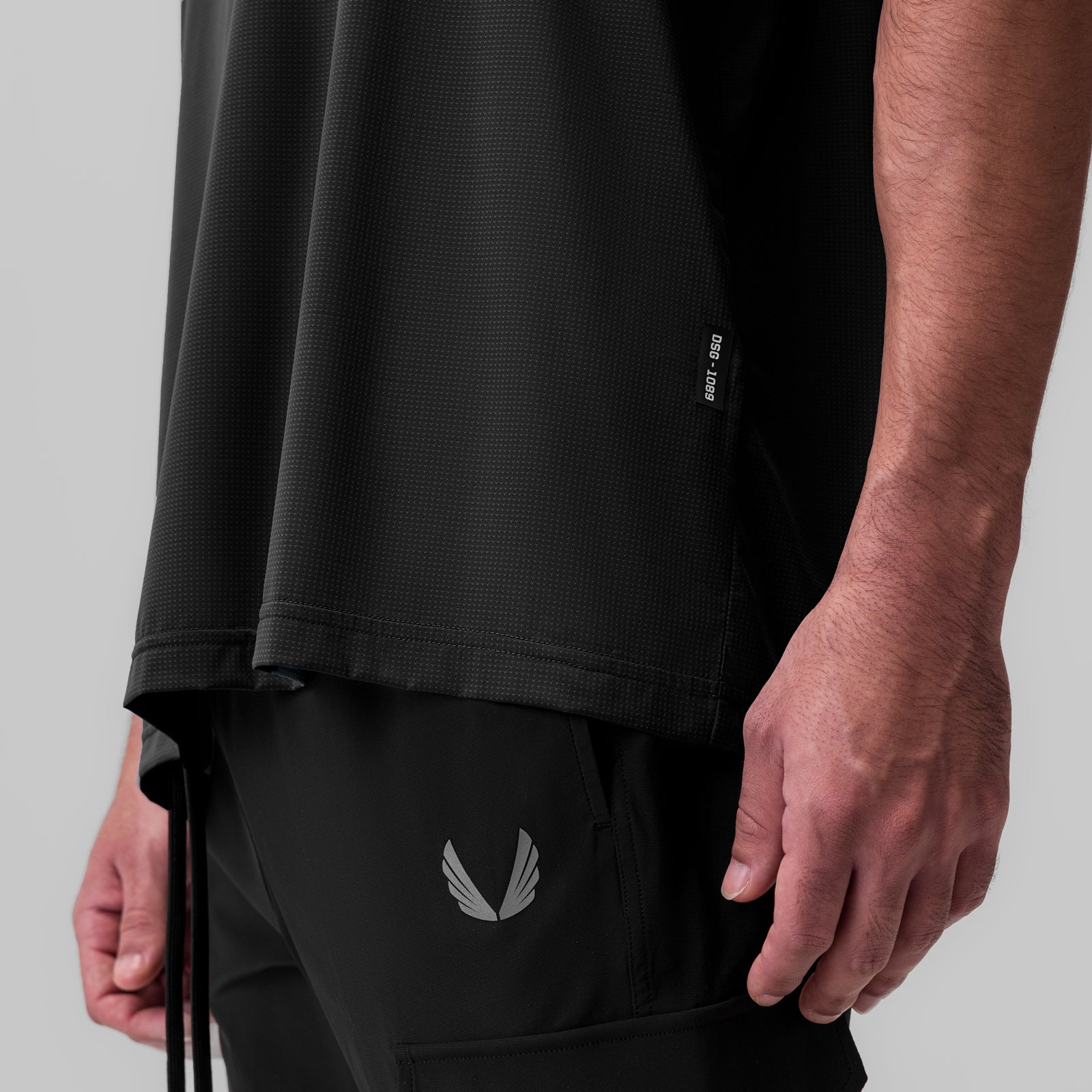 Ice-Skin Oversized Tee in black worn by model, side view detail