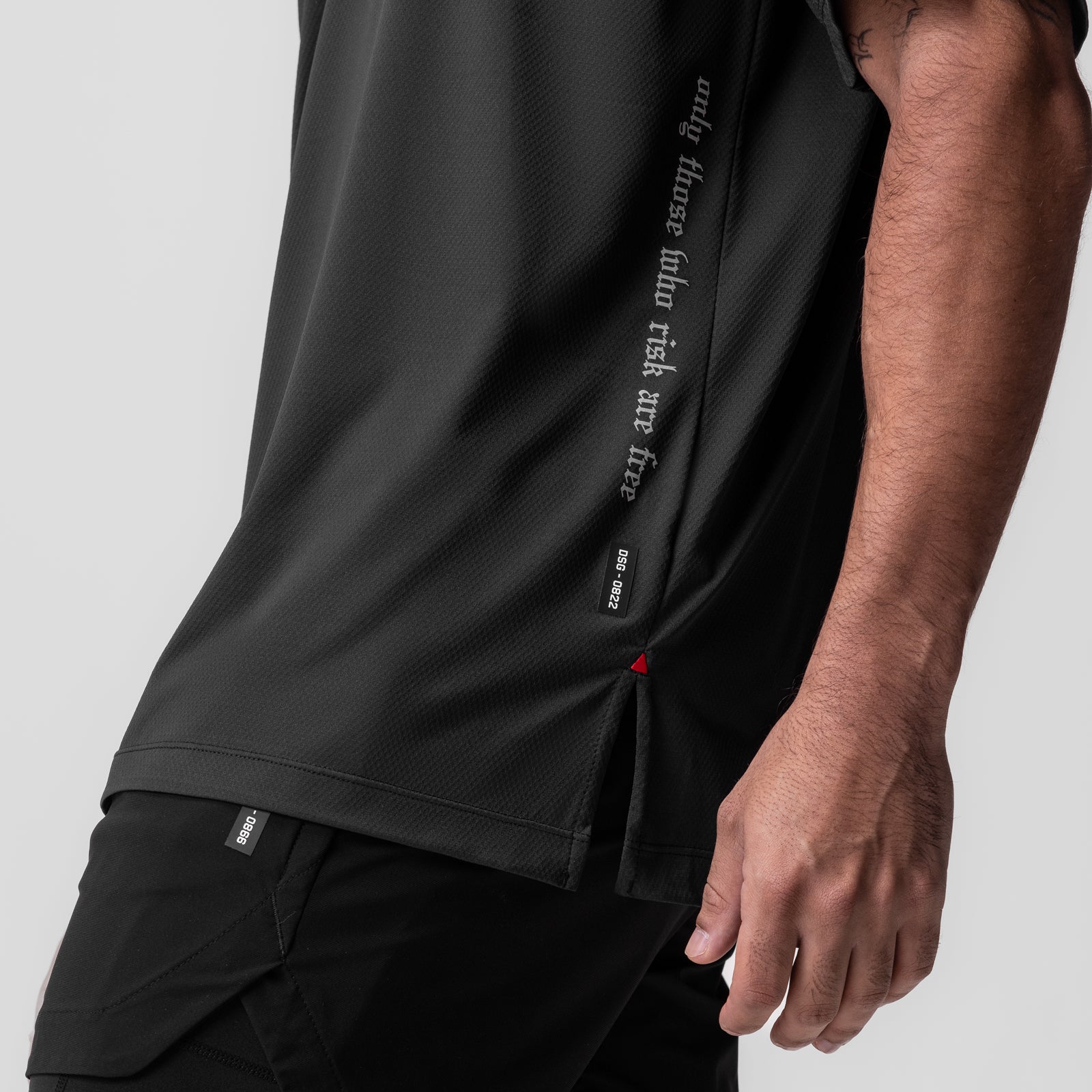 AeroSilver Oversized Tee in black worn by model, side view showing text details