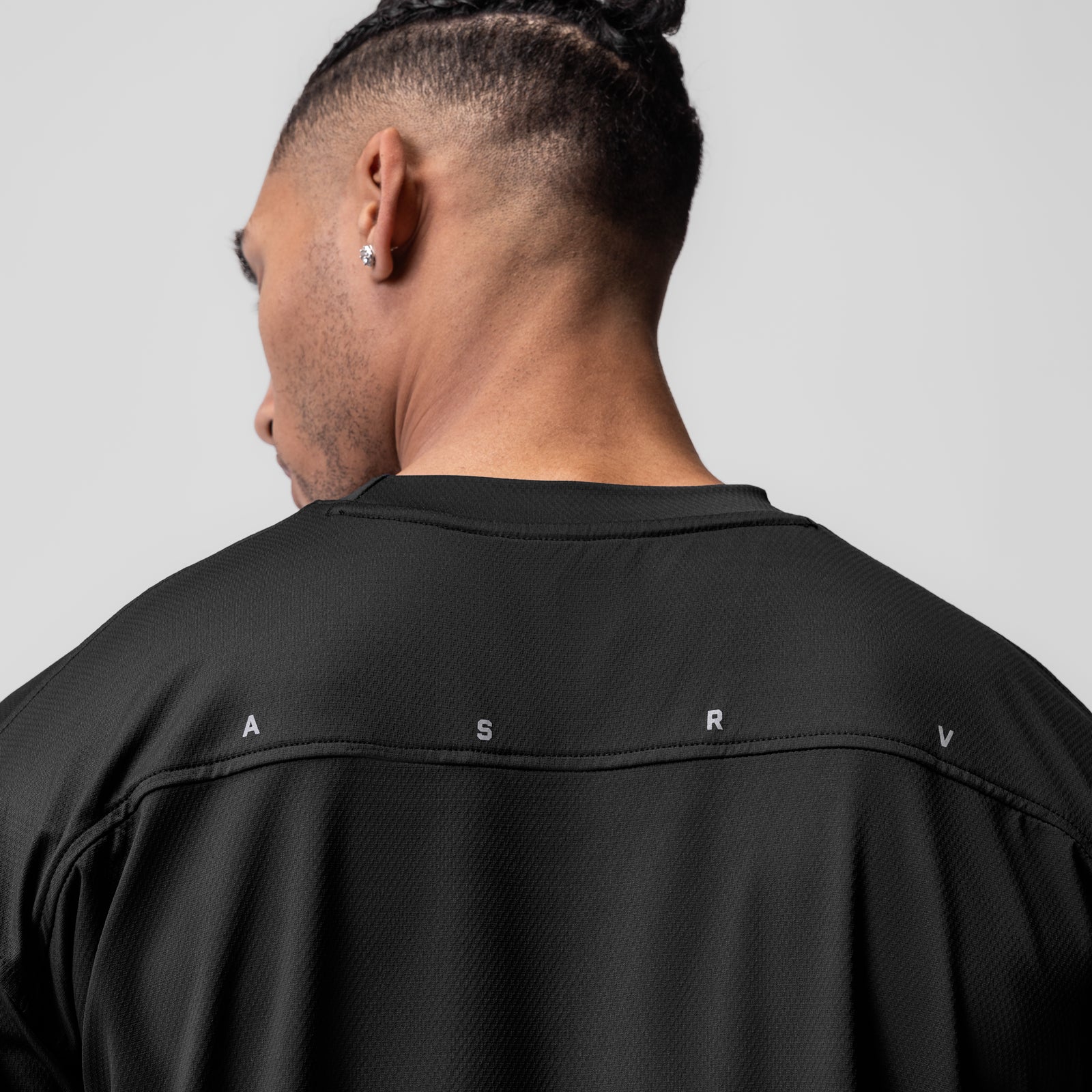 AeroSilver Oversized Tee in black, rear view on model showing ASRV branding