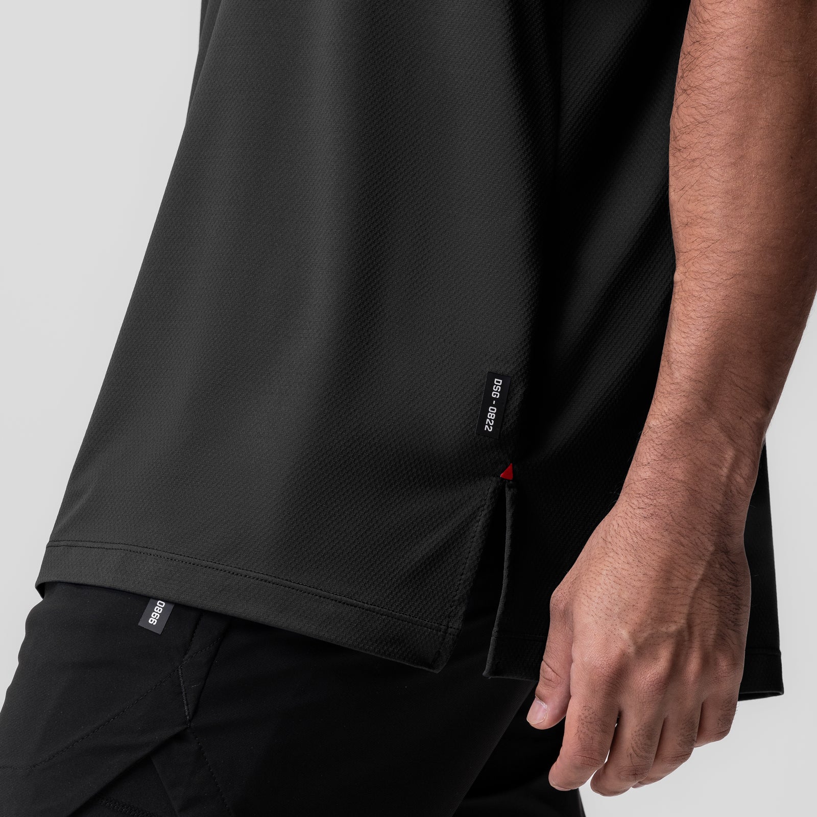 AeroSilver Oversized Tee in black worn by model, side detail view