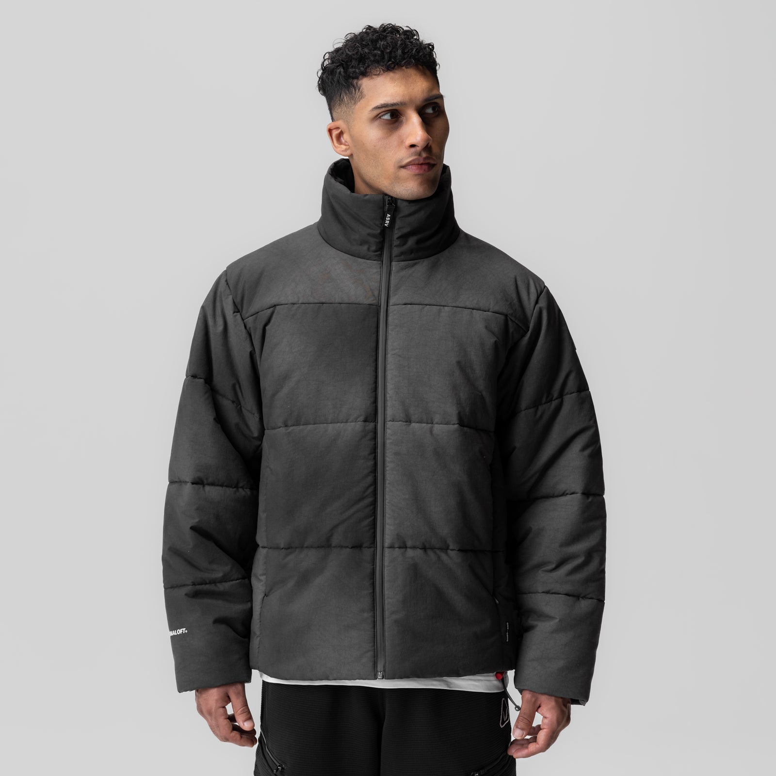 Black PrimaLoft Weather-Ready Puffer Jacket modeled front view, standing pose