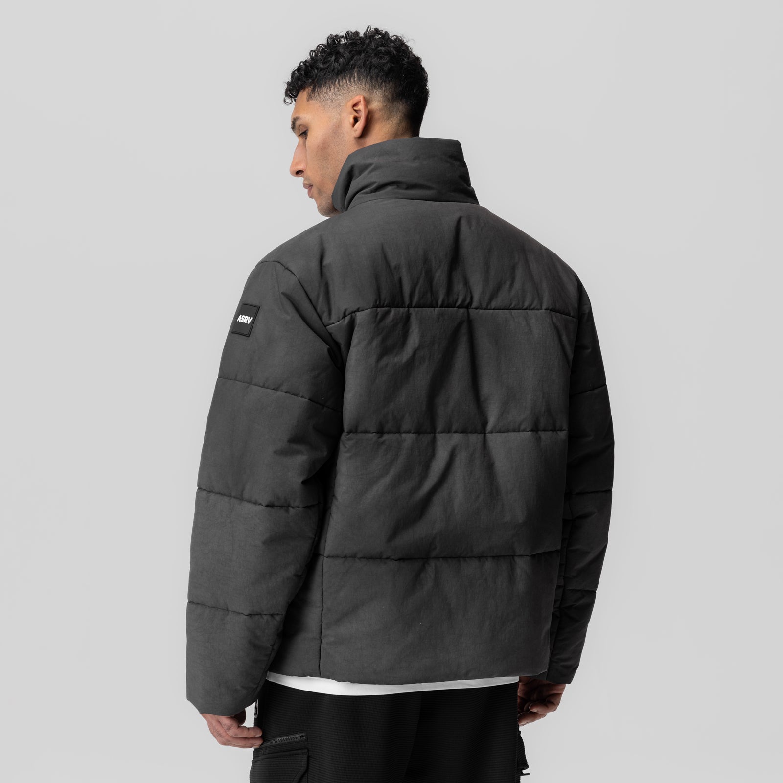 PrimaLoft® Weather-Ready Puffer Jacket in black, rear view on model