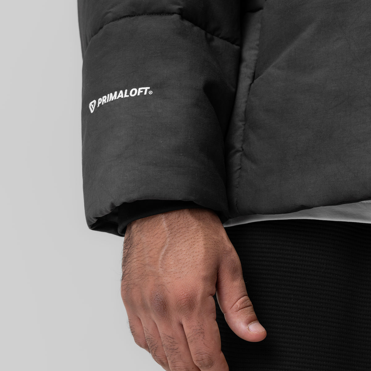 PrimaLoft® Weather-Ready Puffer Jacket in black, worn by model showing sleeve detail and branding