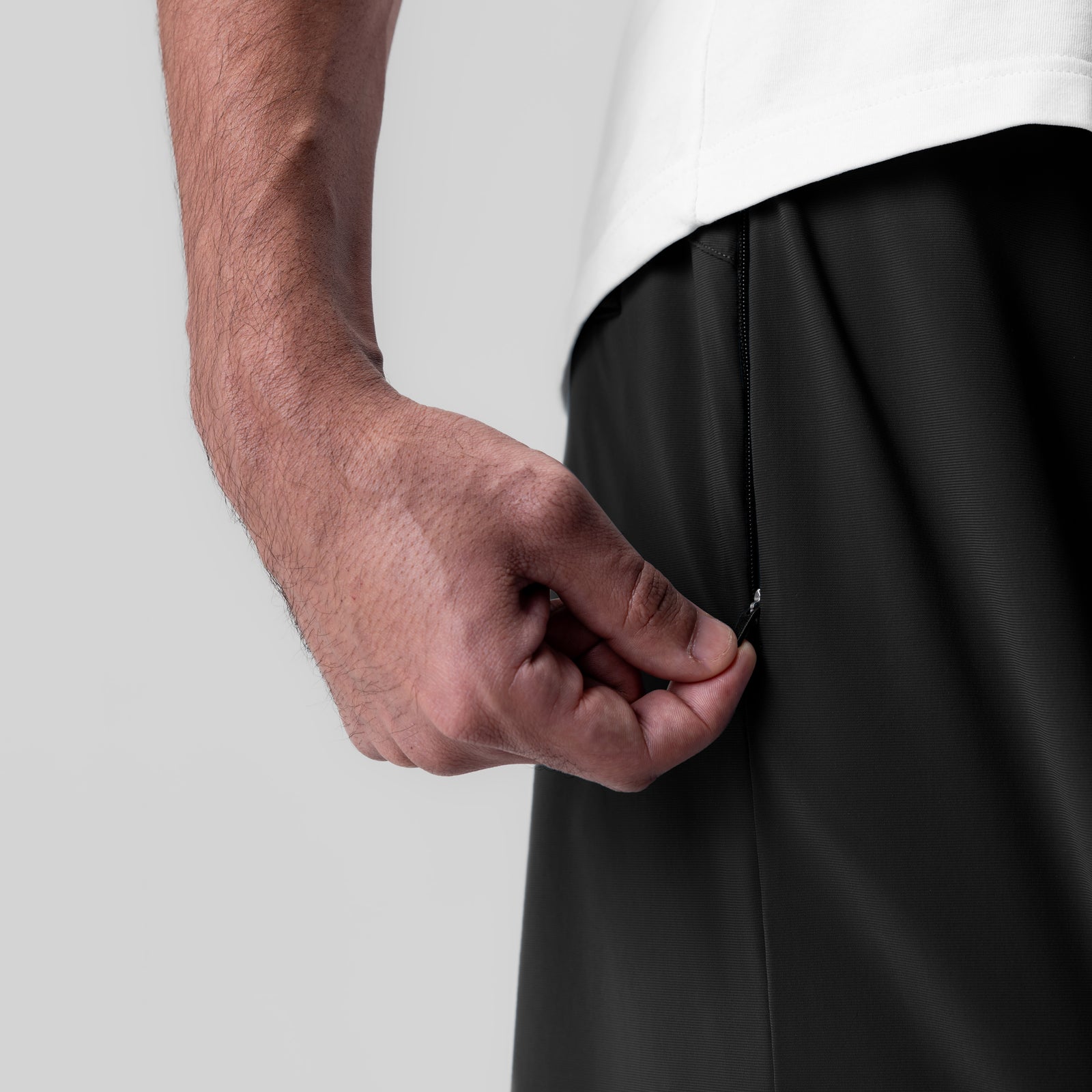 Revolutional Field Short in black, worn by model showing side pocket detail