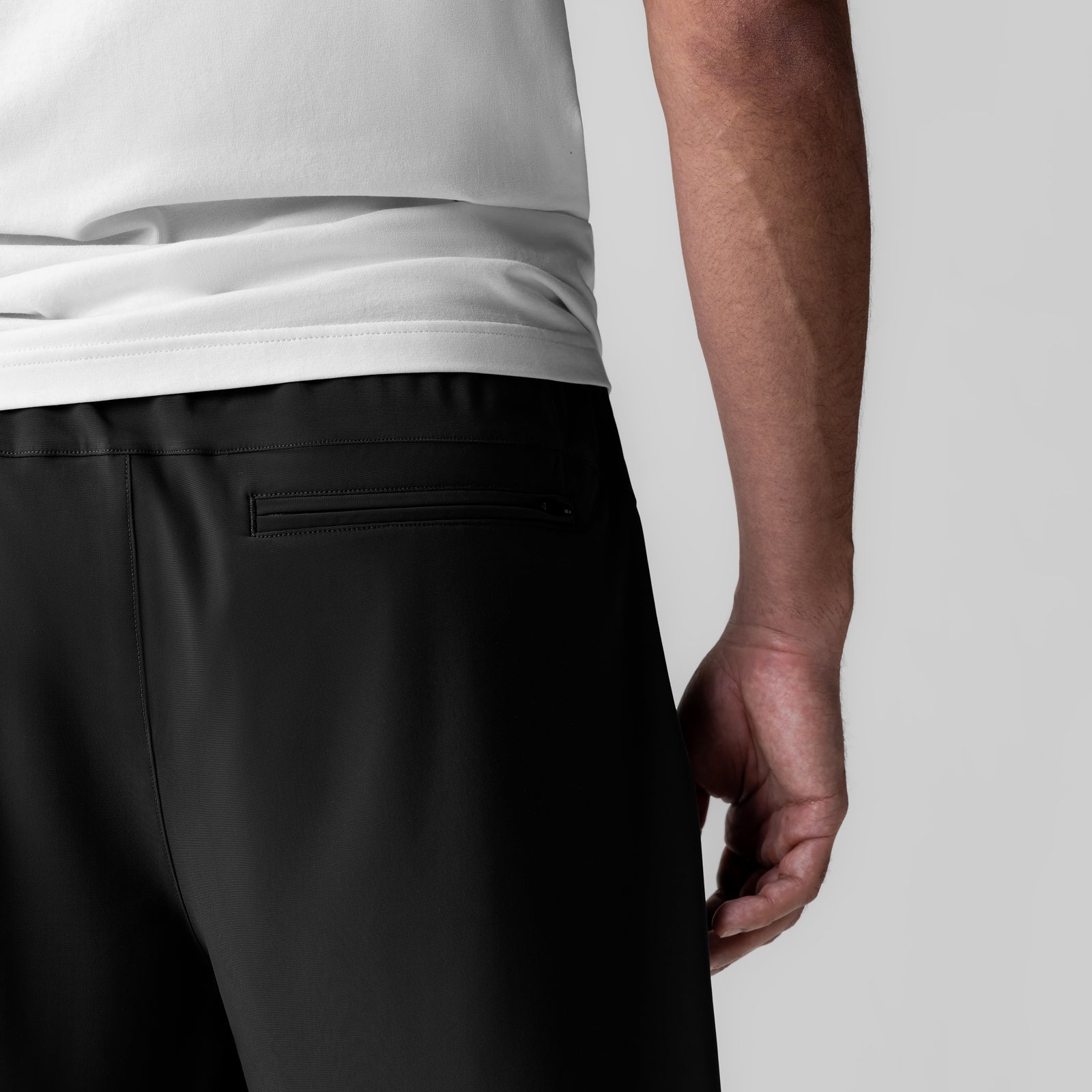 Revolutional Field Short in black, worn by model, side view showing fit and pocket detail