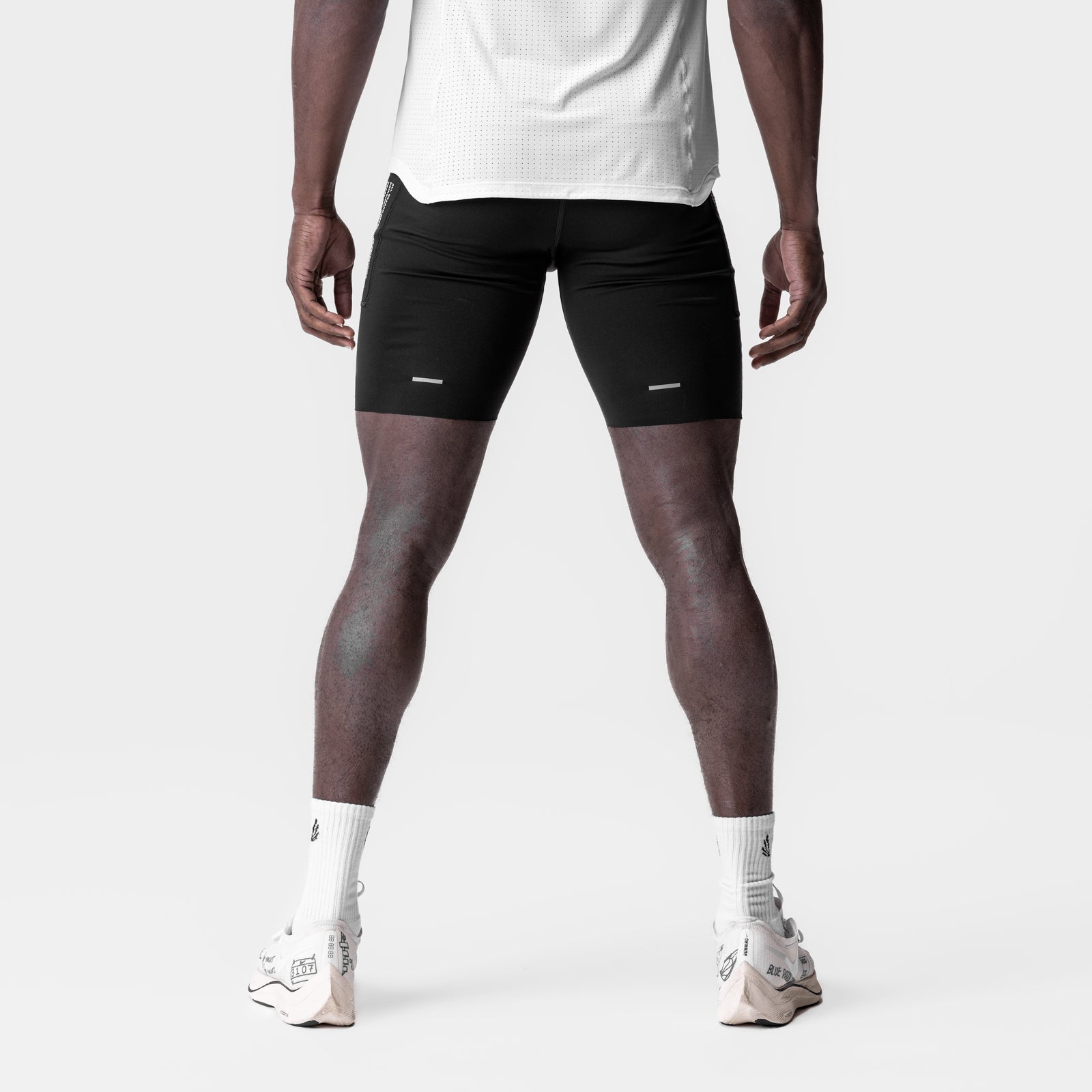 WarpFlexx® Utility Speed Short in black, worn by model standing from behind