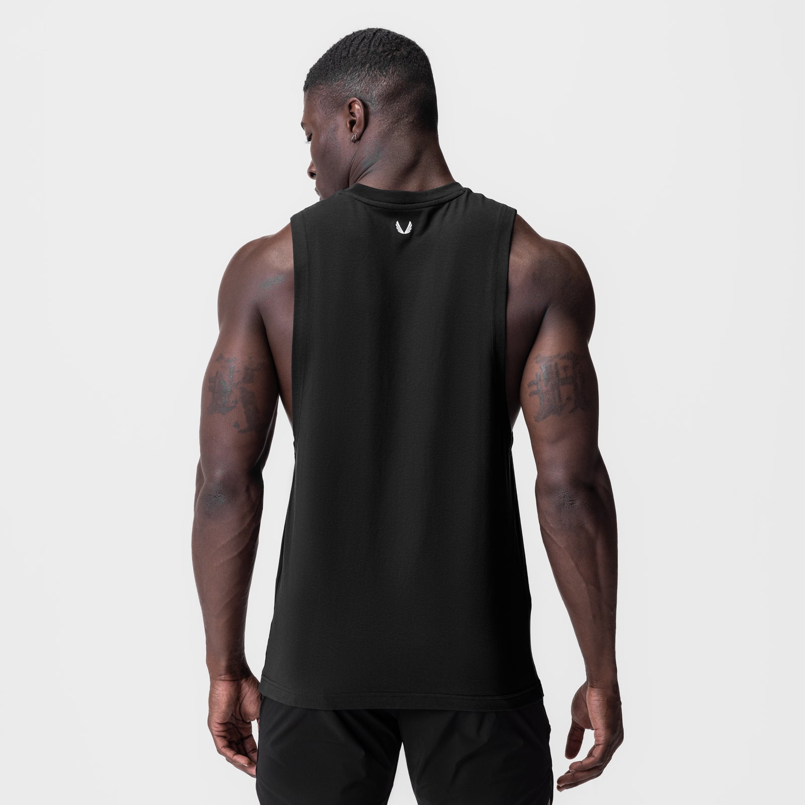Black Supima® Muscle Tank worn by model, back view