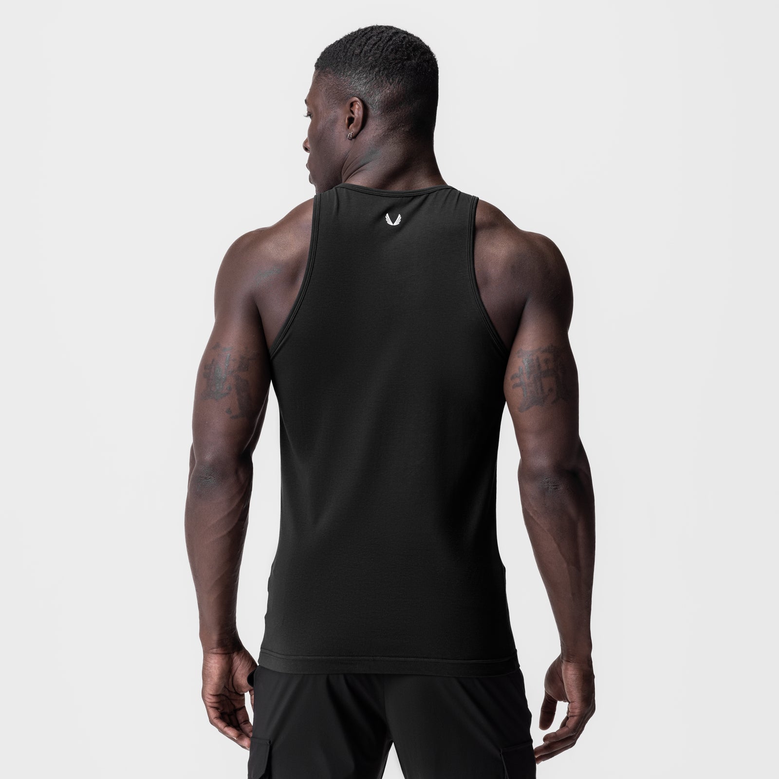 Black Supima Essential Slim Tank worn by model, back view