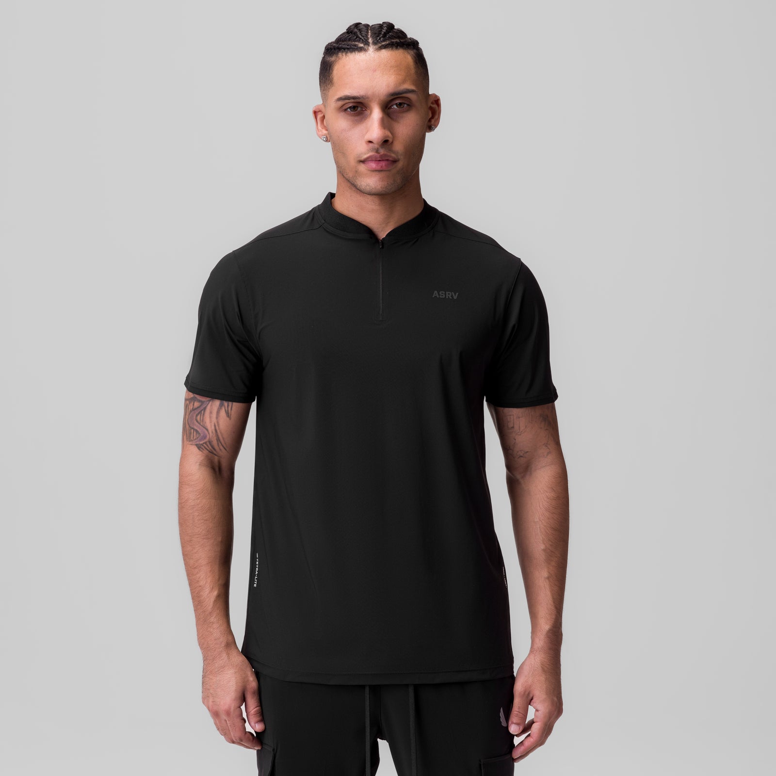 Black Tetra-Lite Ice Zip Tee worn by male model, front view