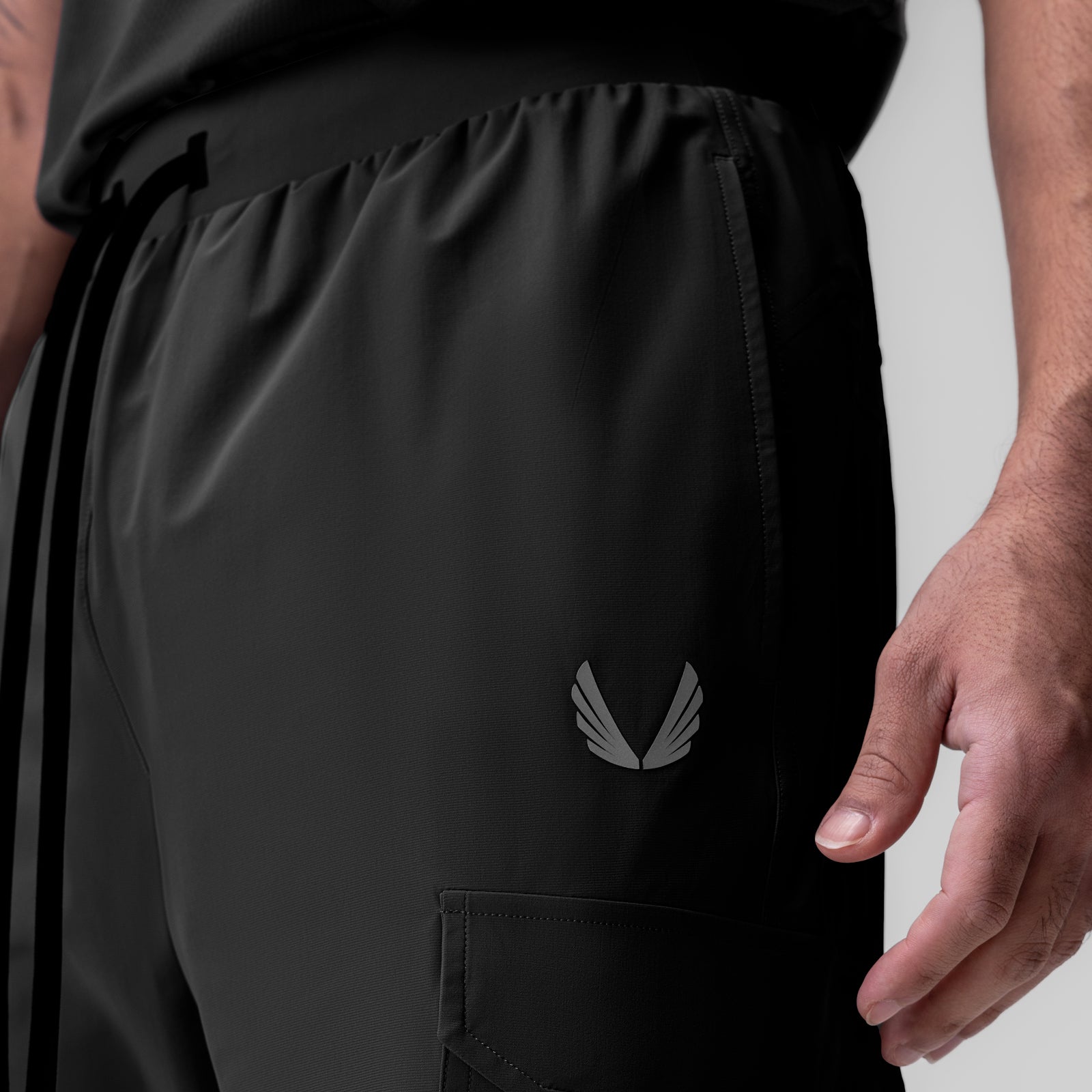 Black Tetra-Lite Ice Cargo High Rib Jogger worn by model, side view detail