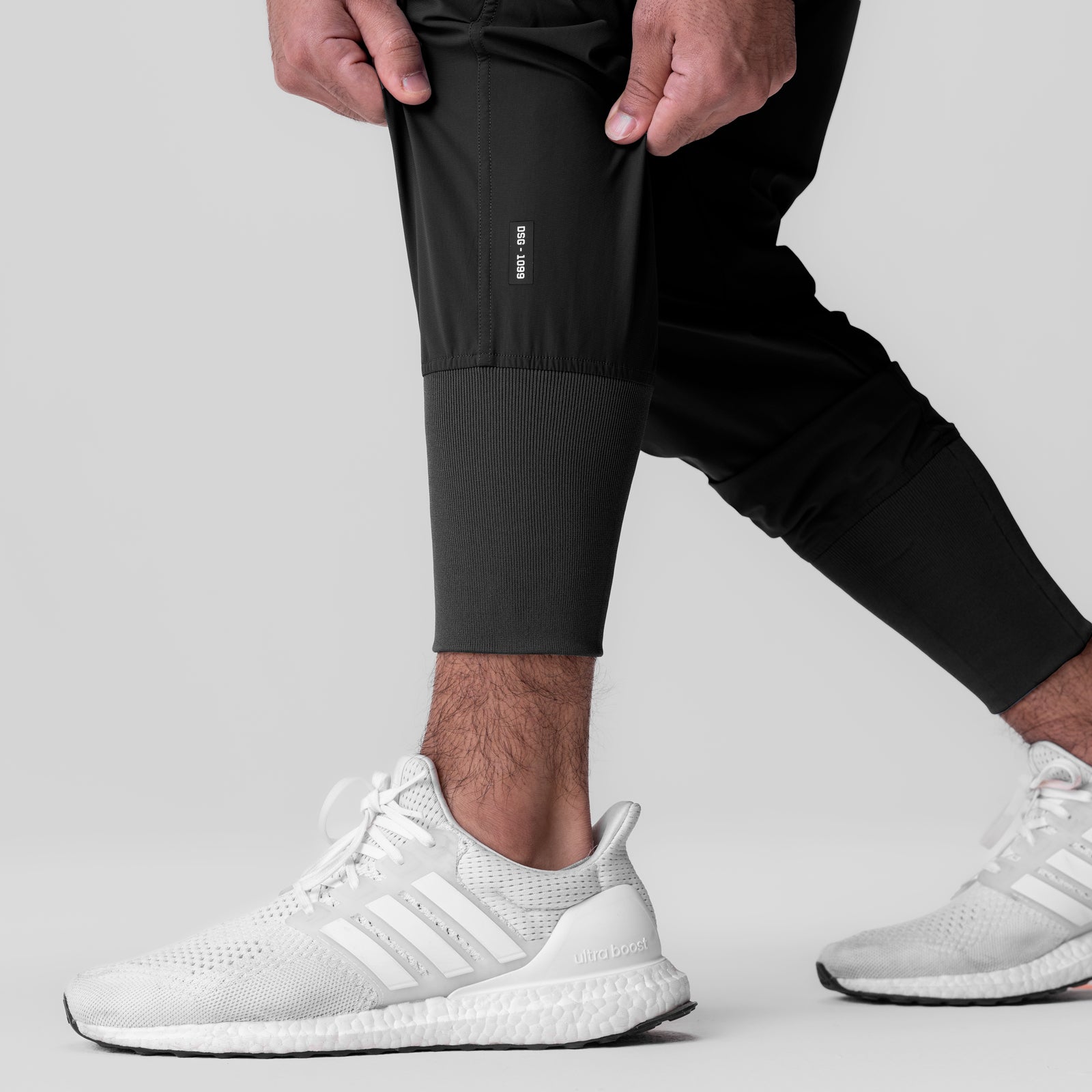 Black Tetra-Lite Ice Cargo High Rib Jogger worn with white sneakers, cropped leg view