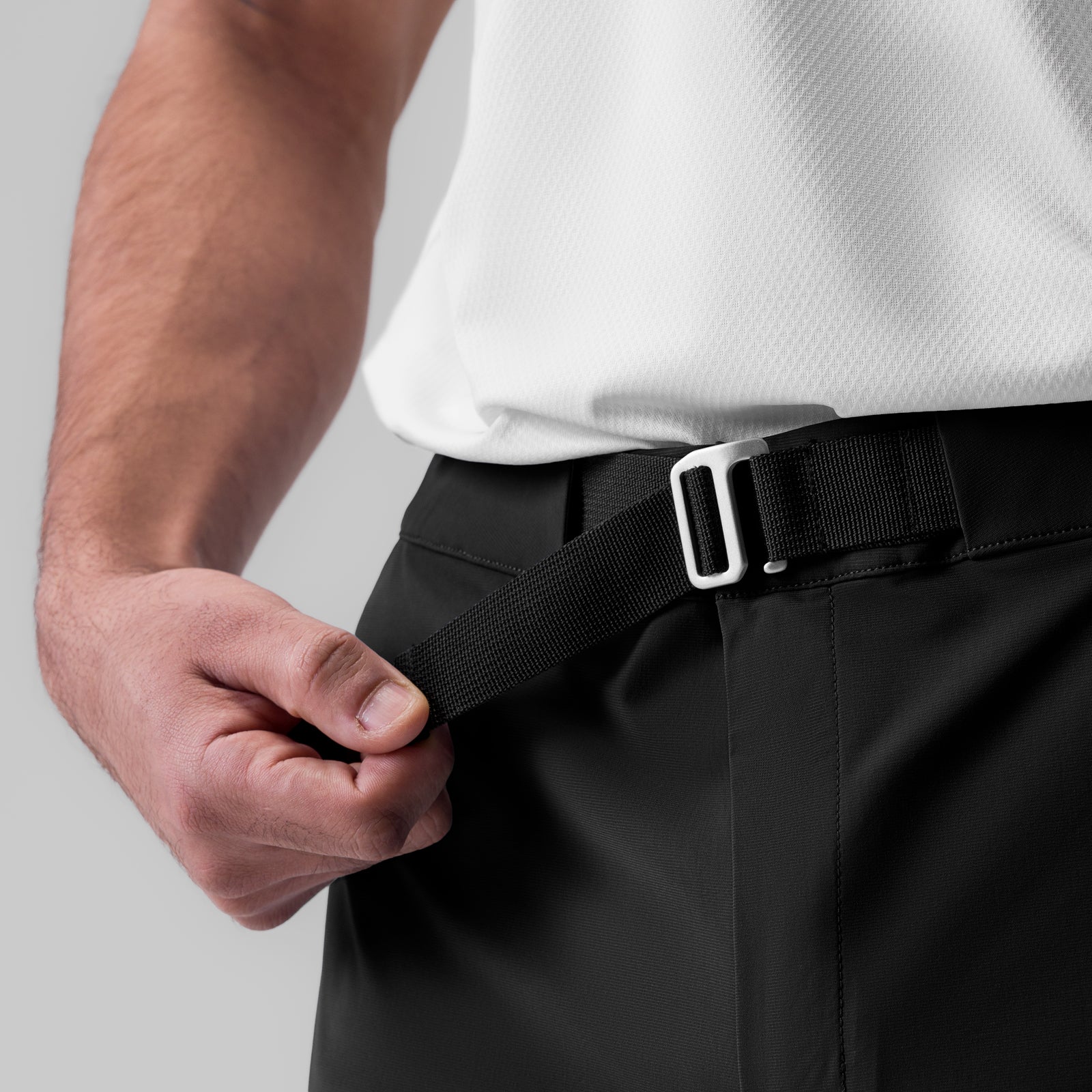 Tetra-Lite Field Pant in black worn by model, detail shot of belt and waistband