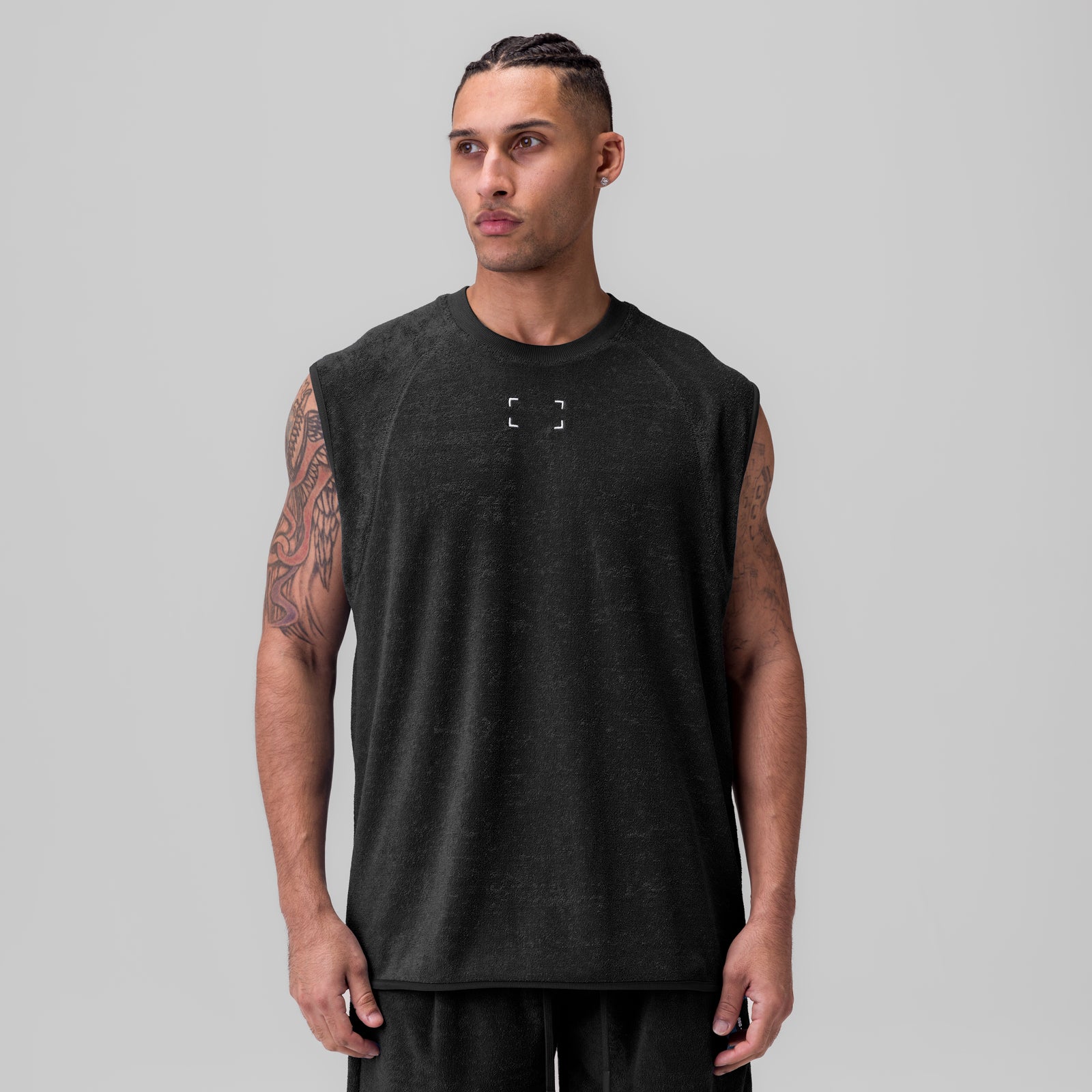 Black towel terry cutoff sleeveless tank on model, front view