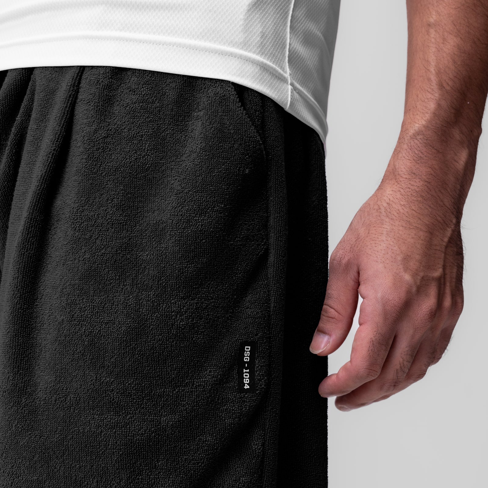 Towel Terry Relaxed Short in black, worn by model showing side detail and fit