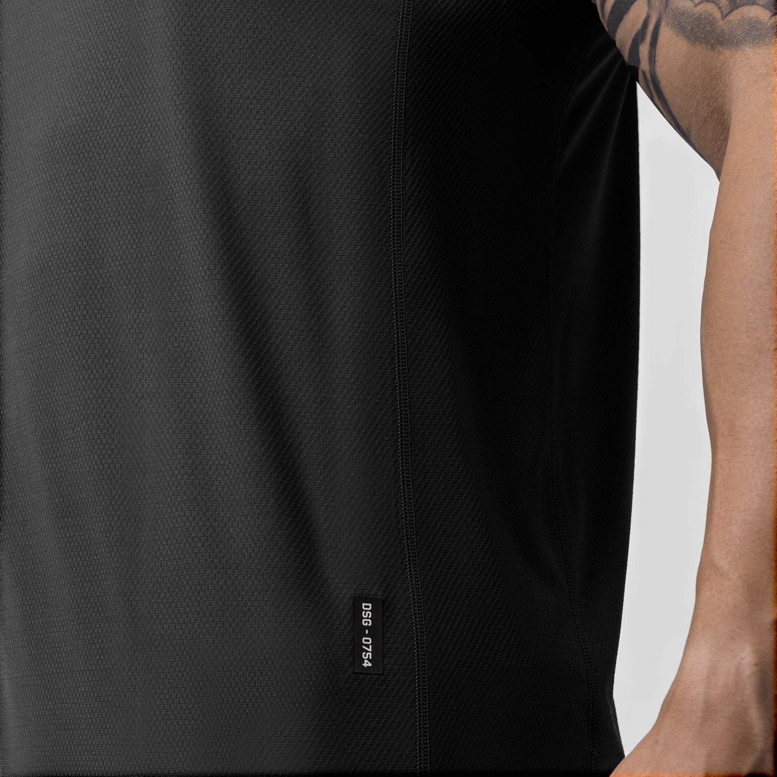 AeroSilver Training Singlet in black worn by model, side view showing fabric texture