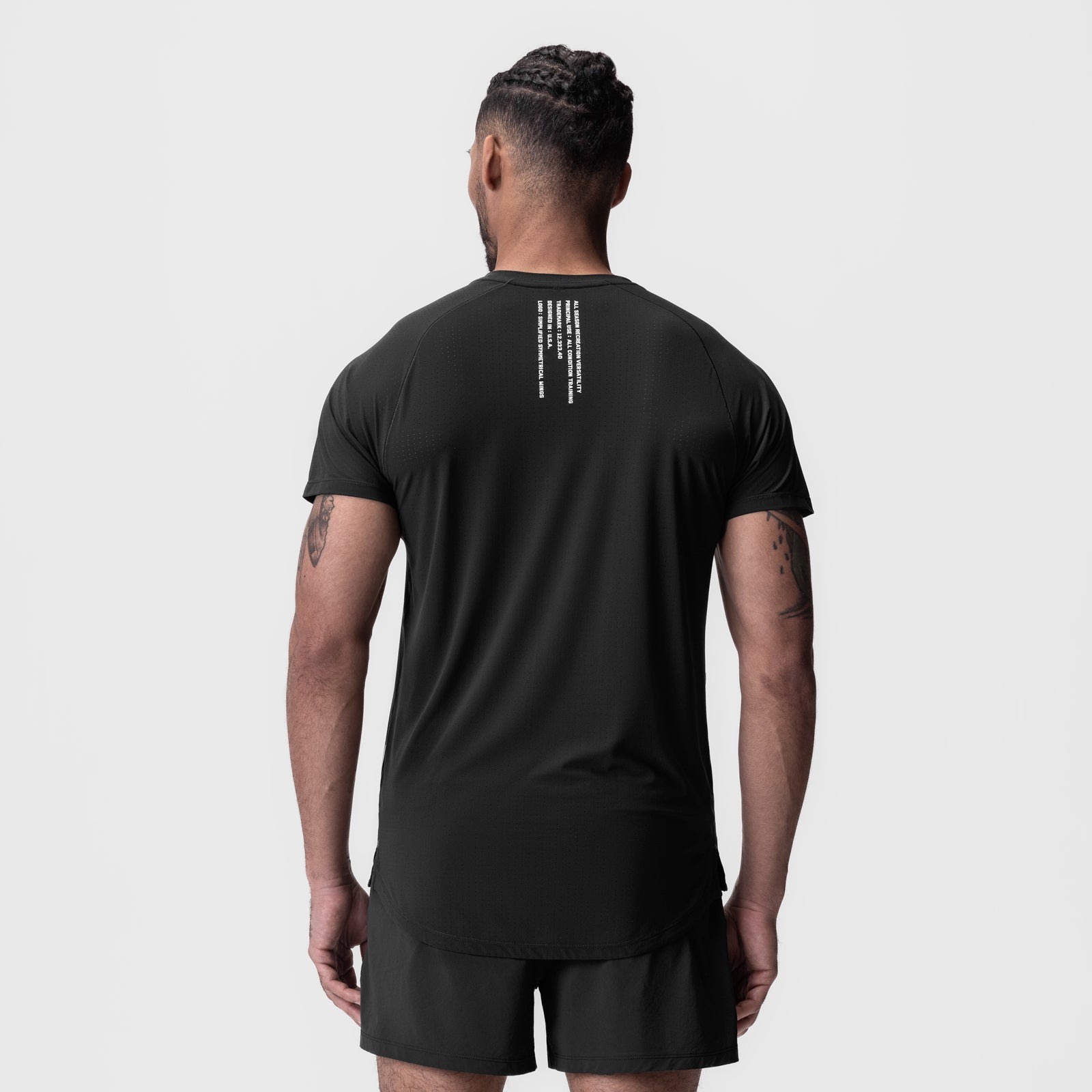 Black Laser-Vent Established Tee worn by model, back view showing graphic print