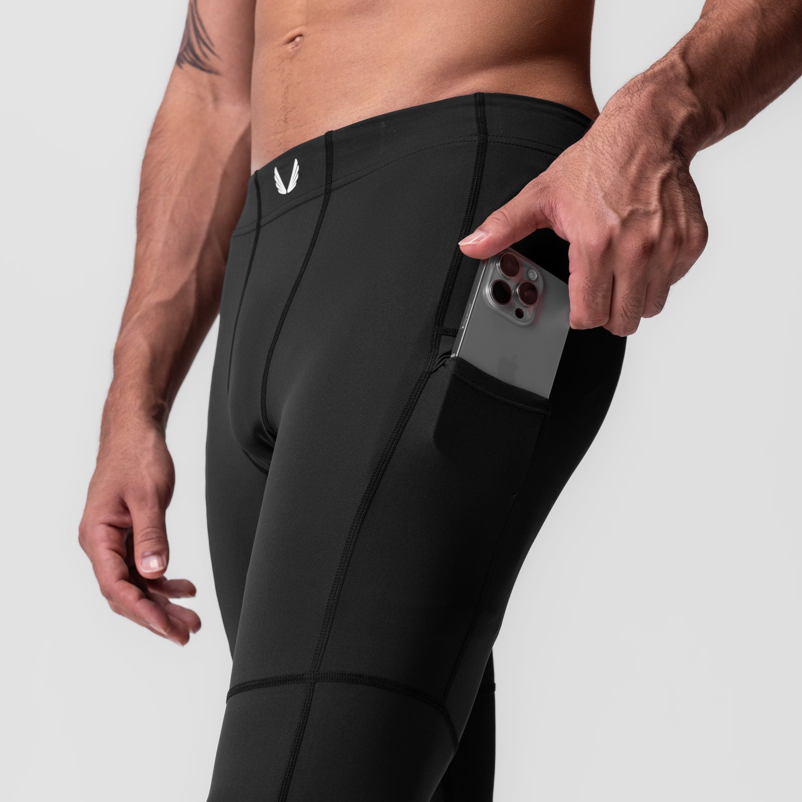 WarpFlexx-Lite 3/4-length legging in black with phone pocket, worn by model