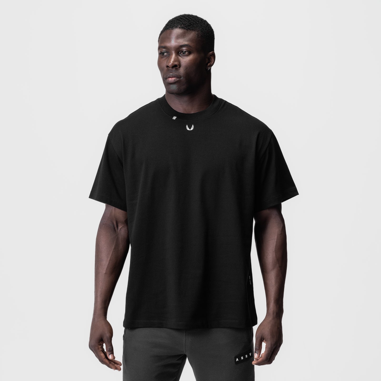 Black Tech Essential Relaxed Tee worn by model, front view