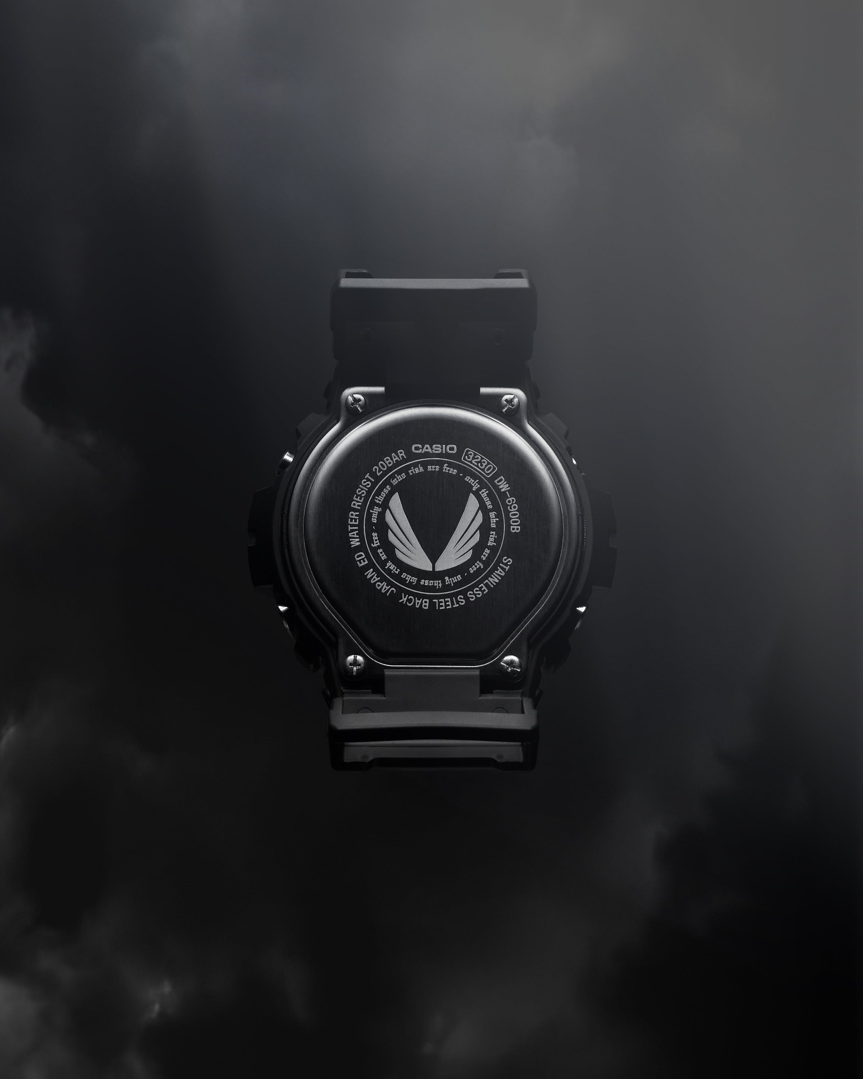 ASRV x G-SHOCK DW6900 digital watch in black, back view on dark background