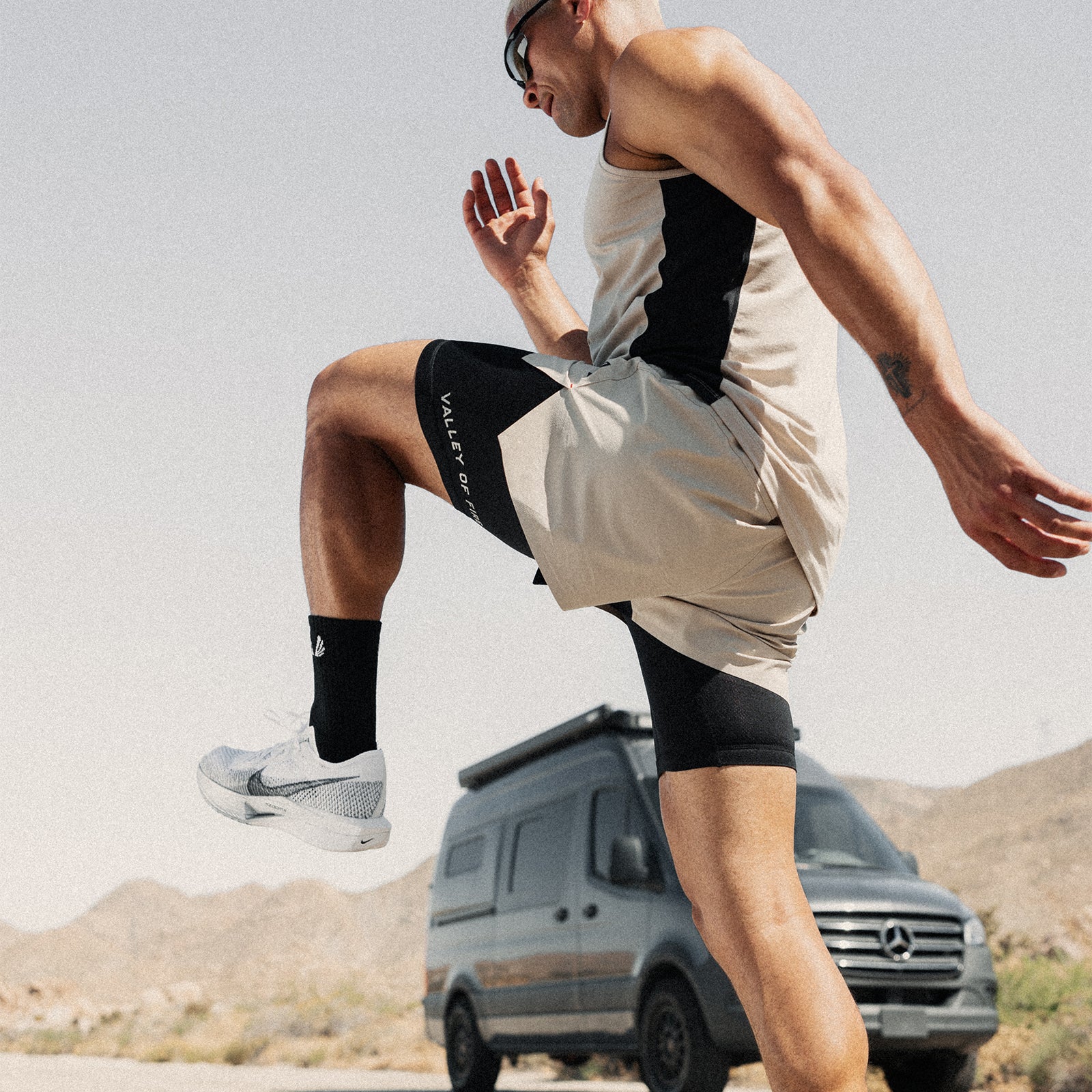 Ripstop 3" Belt Pack Short in beige and black, worn while running outdoors
