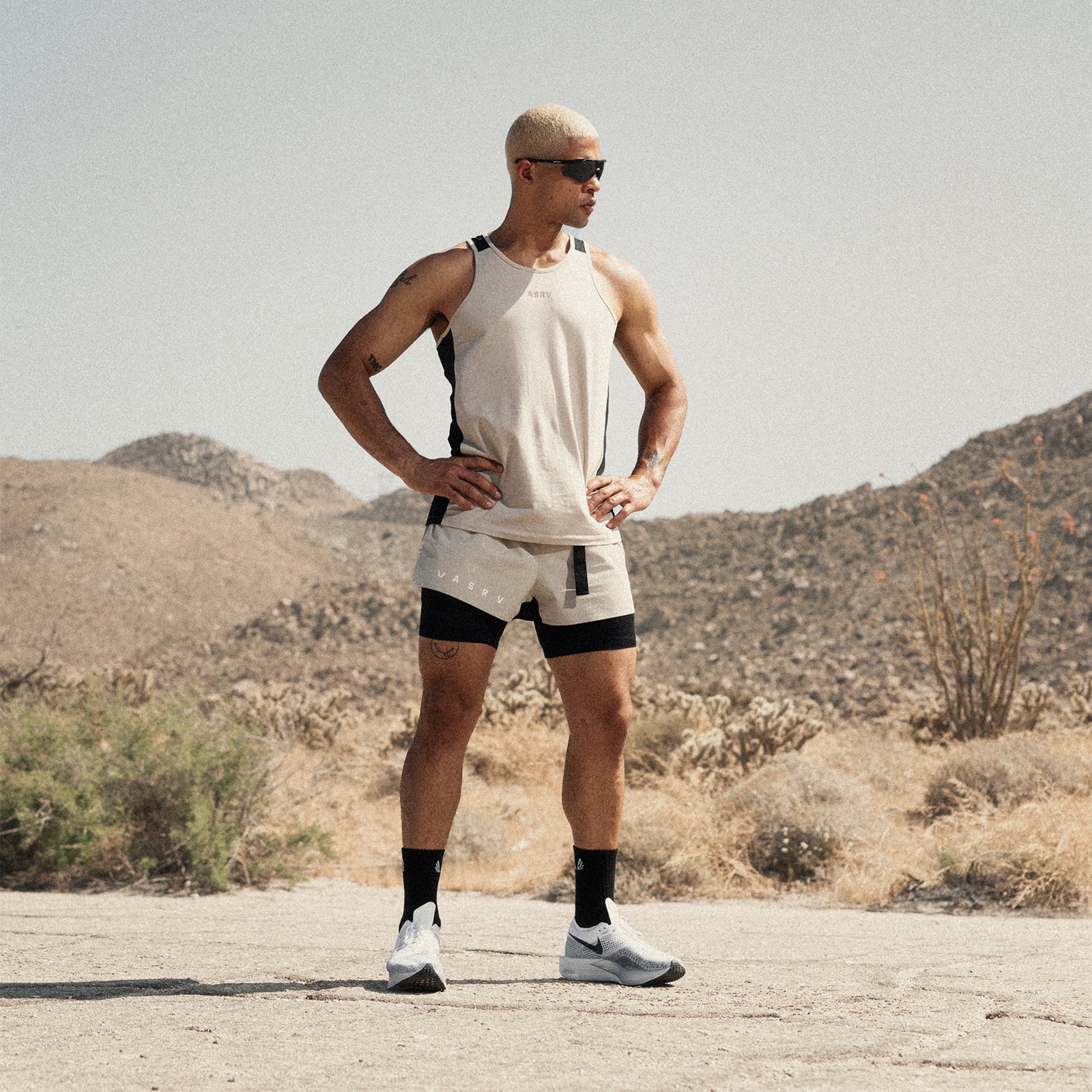Ripstop 3" Belt Pack Short in beige and black, worn by model standing in desert landscape