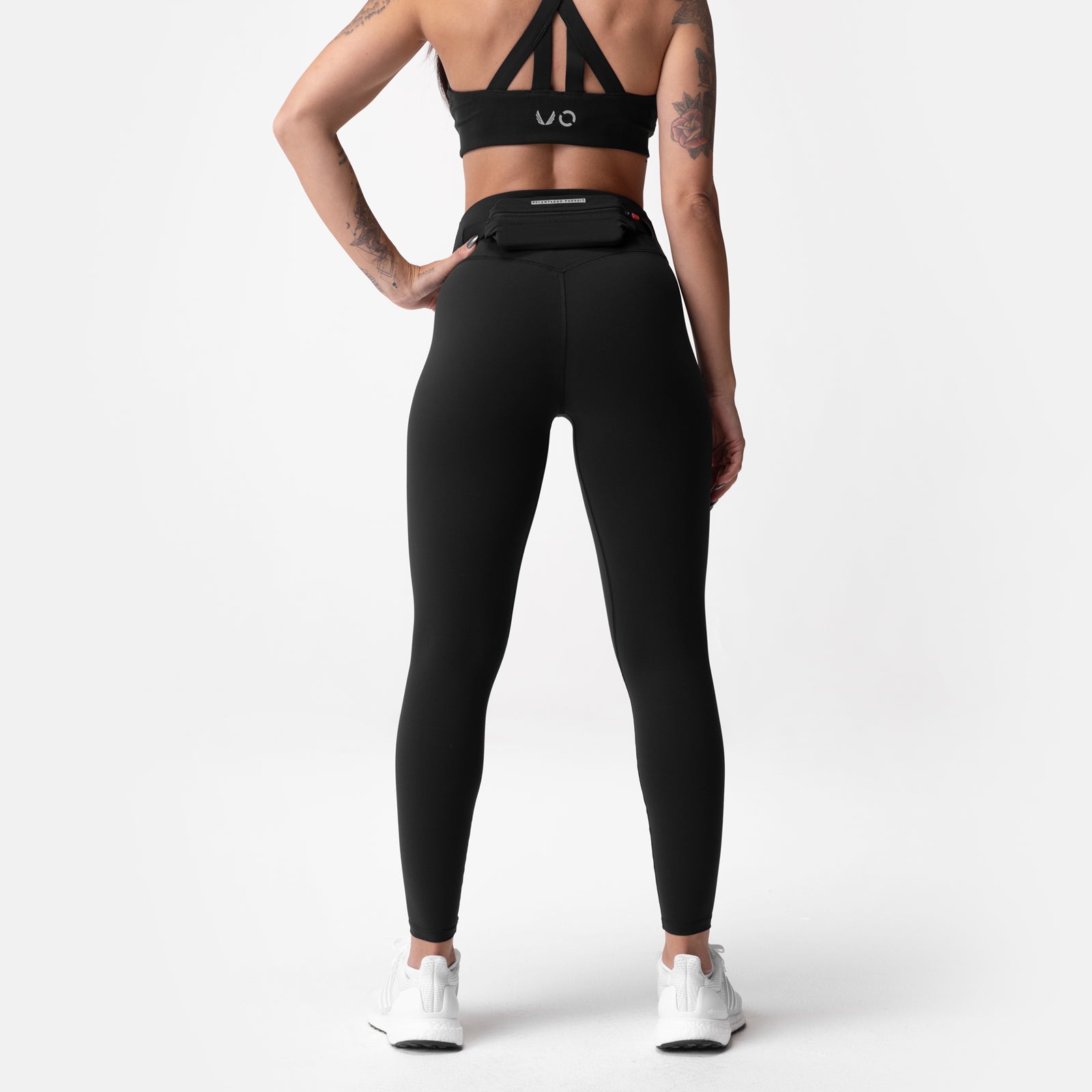 Black Lycra 3-in-1 legging worn by model, back view