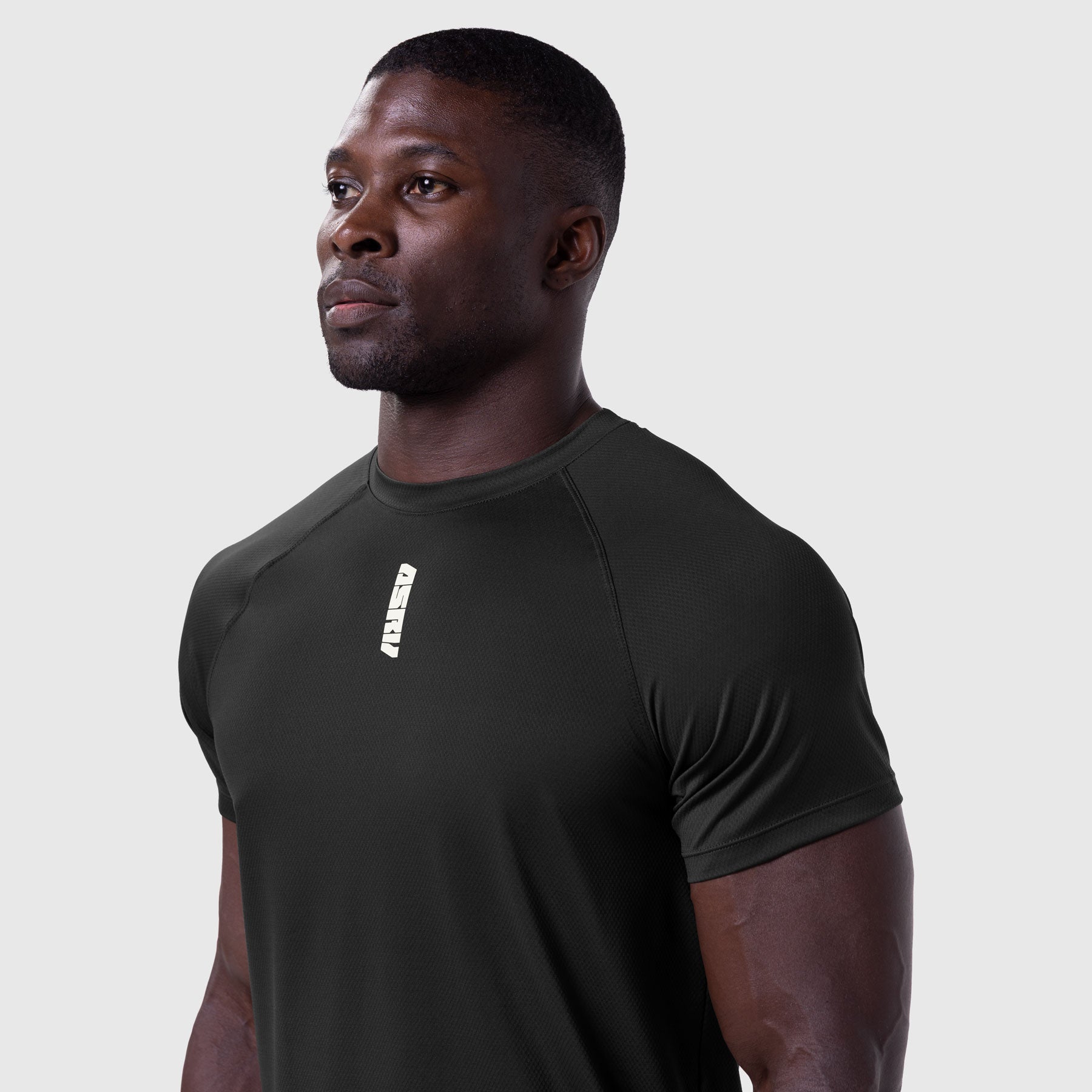 AeroSilver Established Tee in black, worn by model in profile view