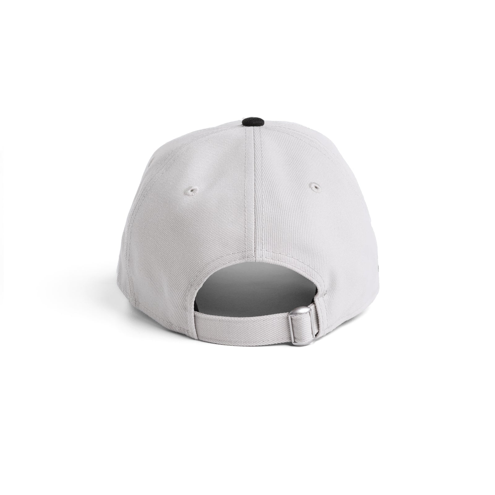 flatlay New Era 9Twenty Strapback Hat in stone and black, back view