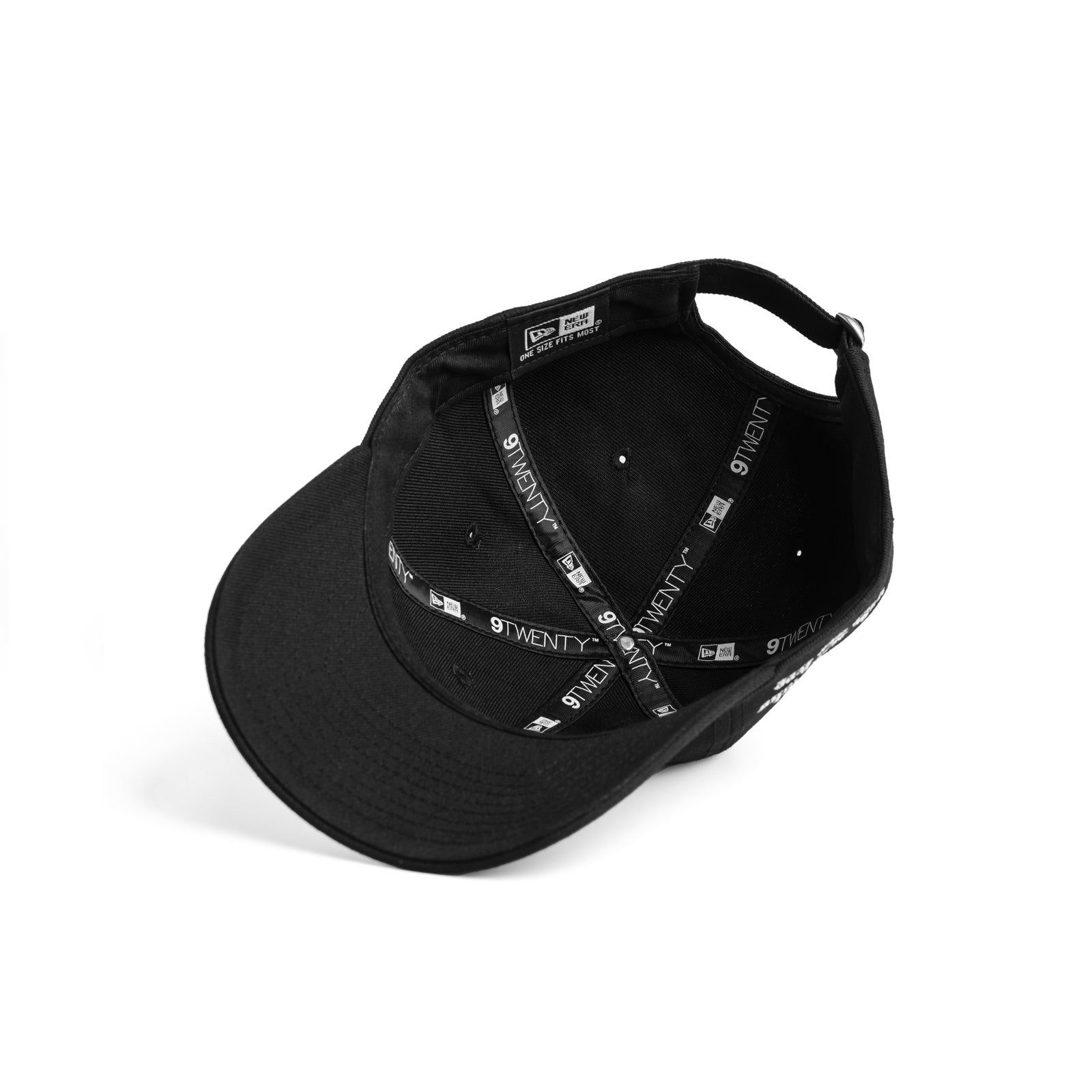flatlay New Era 9Twenty strapback hat in black, interior view showing adjustable strap