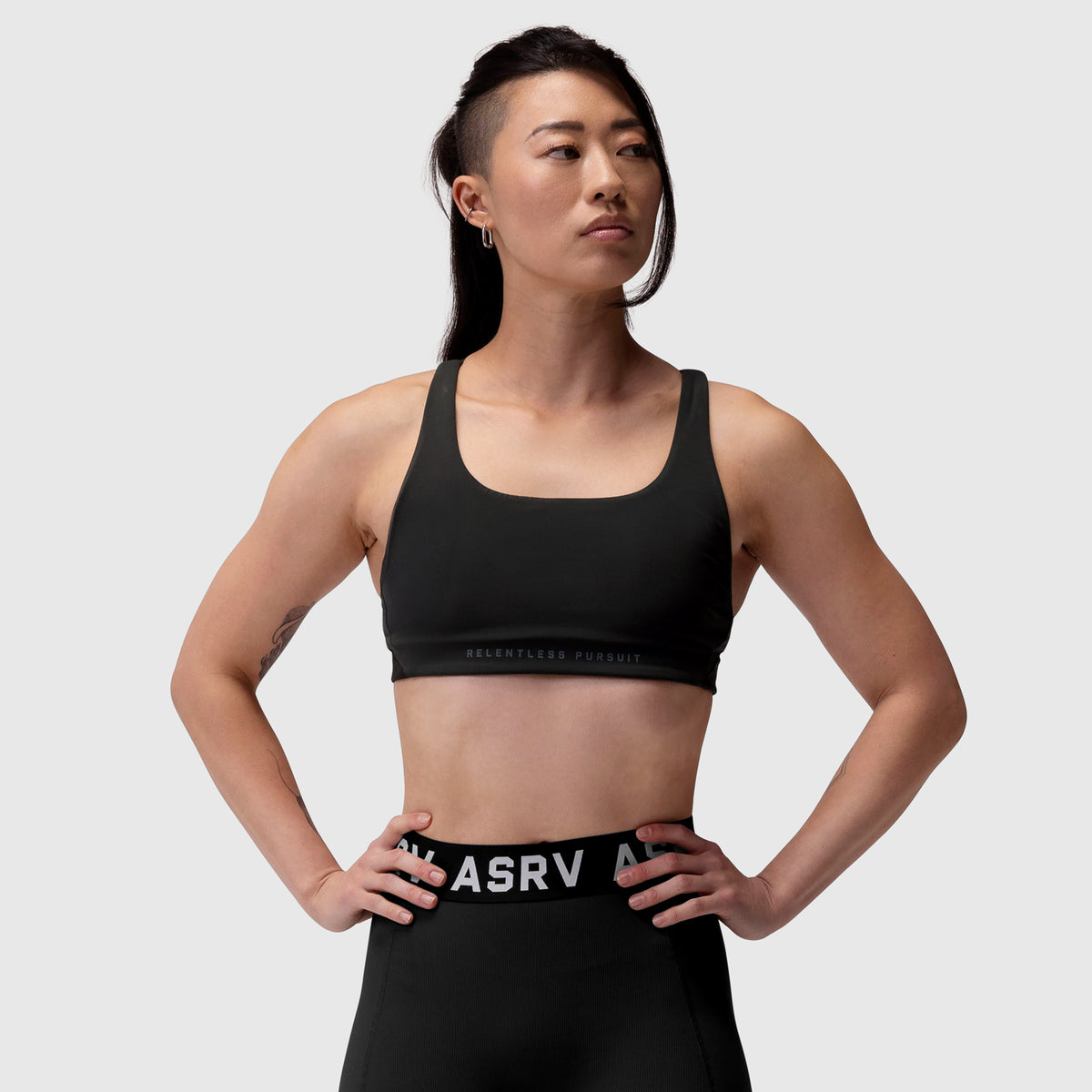 Black LYCRA® Hybrid Sports Bra worn by model, front view