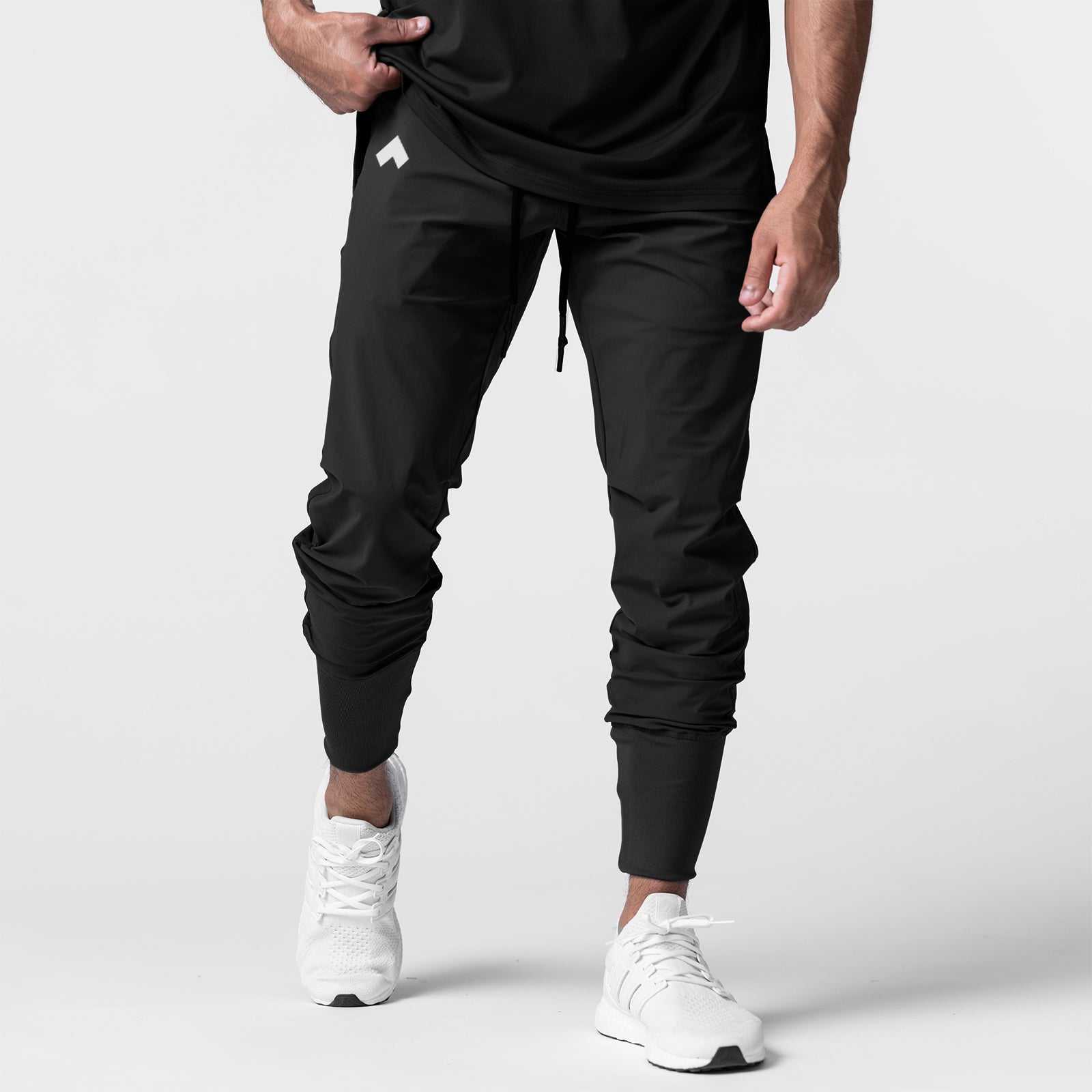 Black High Rib Jogger worn by model with white sneakers, front view