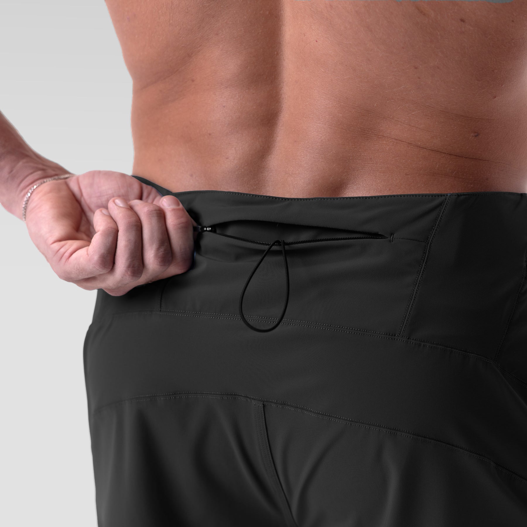 Black Revolutional Board Short worn by model, waistband detail view