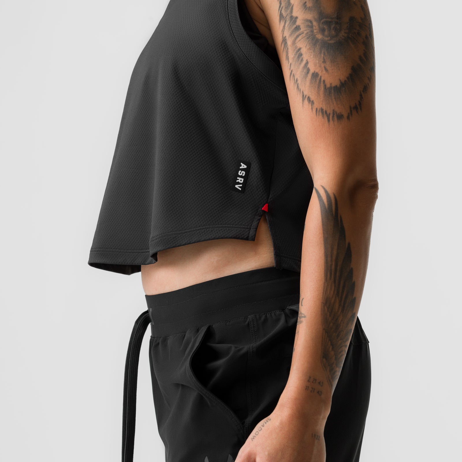Black cropped training tank on model, side view showing fit and ASRV branding