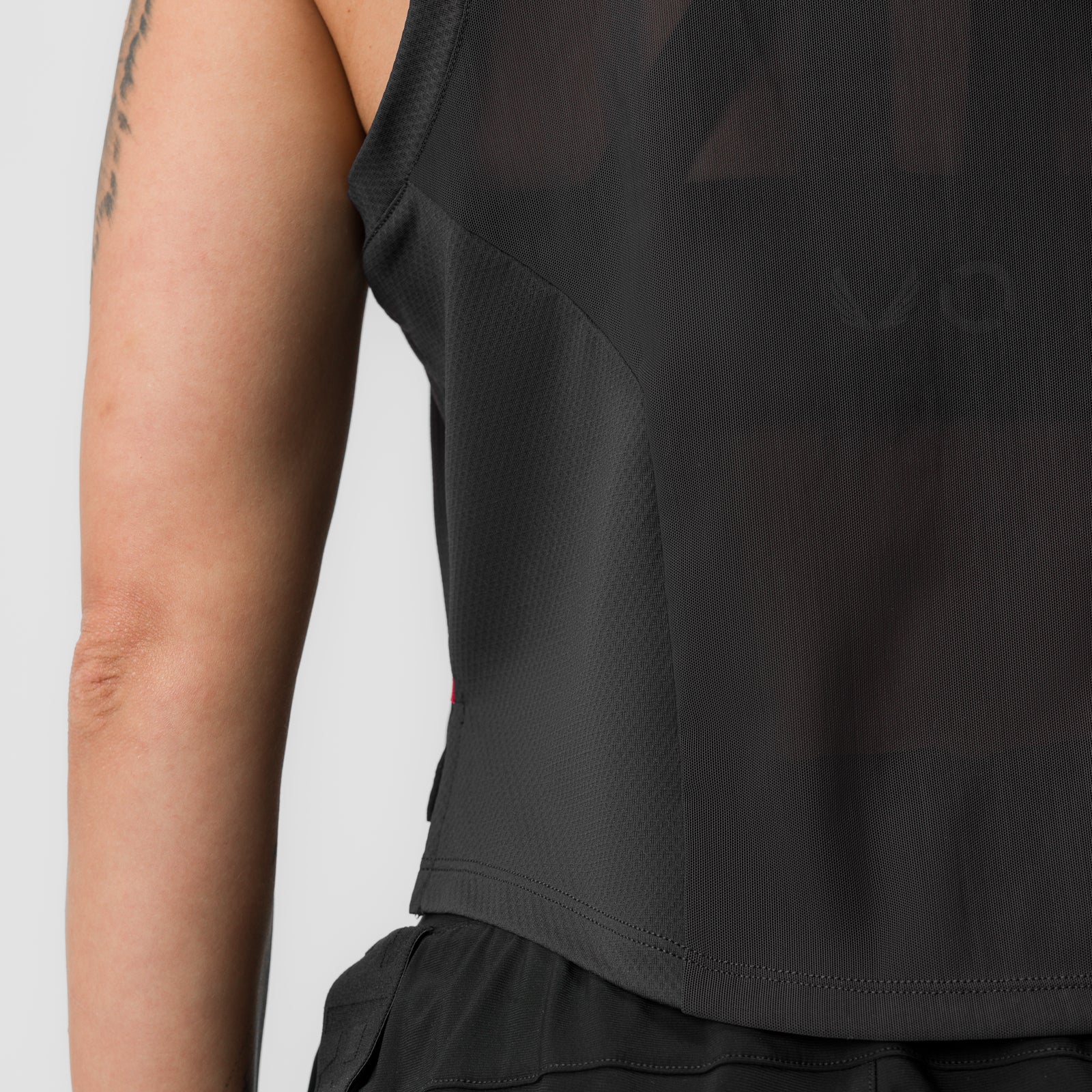 Black AeroSilver cropped training tank worn by model, side view detail