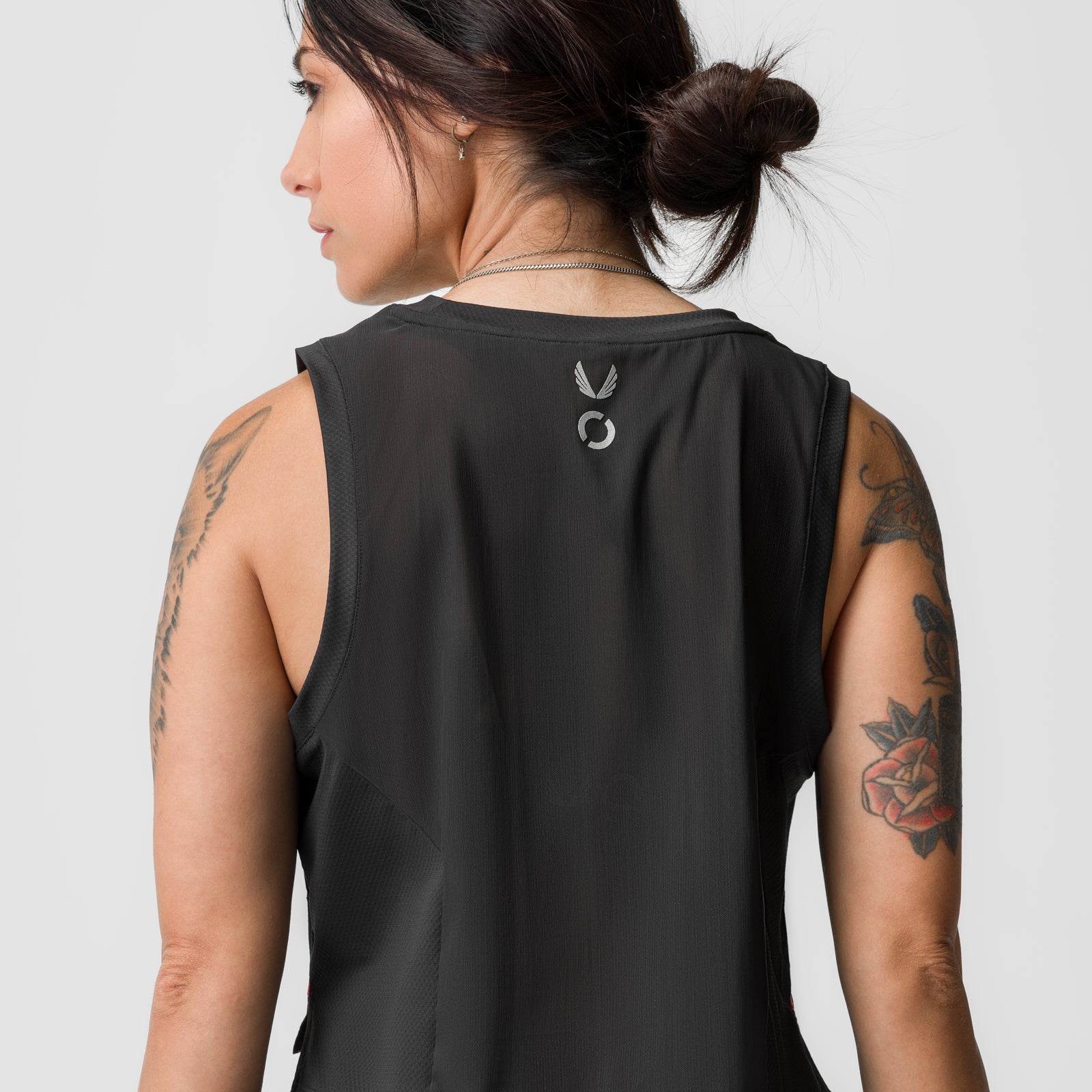 Black cropped training tank on model, back view, showing AeroSilver® logo