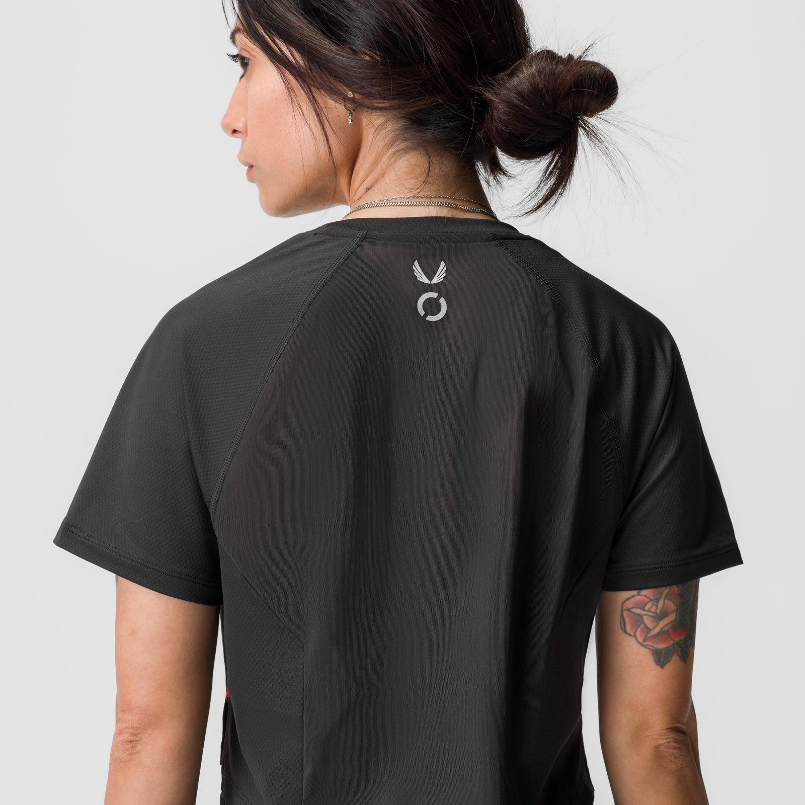 Black AeroSilver® cropped training tee worn by model, back view