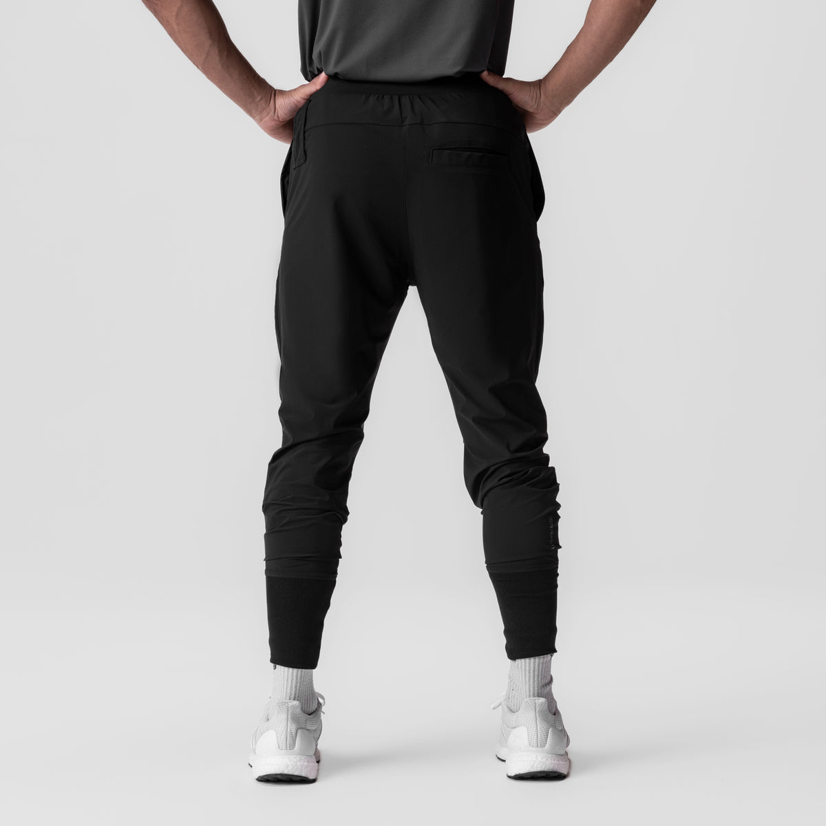 Black Tetra-Lite® Tech High Rib Jogger worn by model, back view
