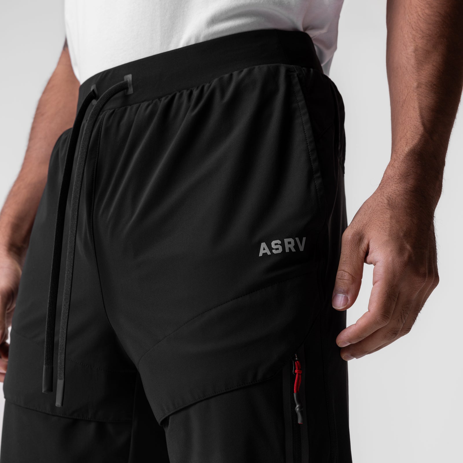 Tetra-Lite Tech High Rib Jogger in black, worn by model, side detail view